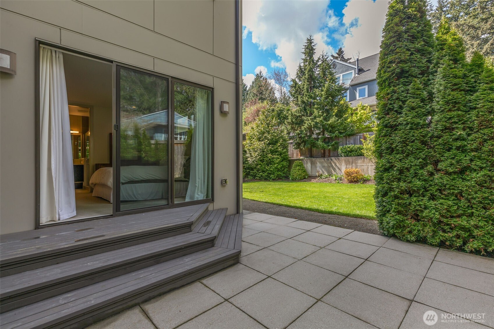 Sliders from the primary suite directly onto your private patio and fenced yard.