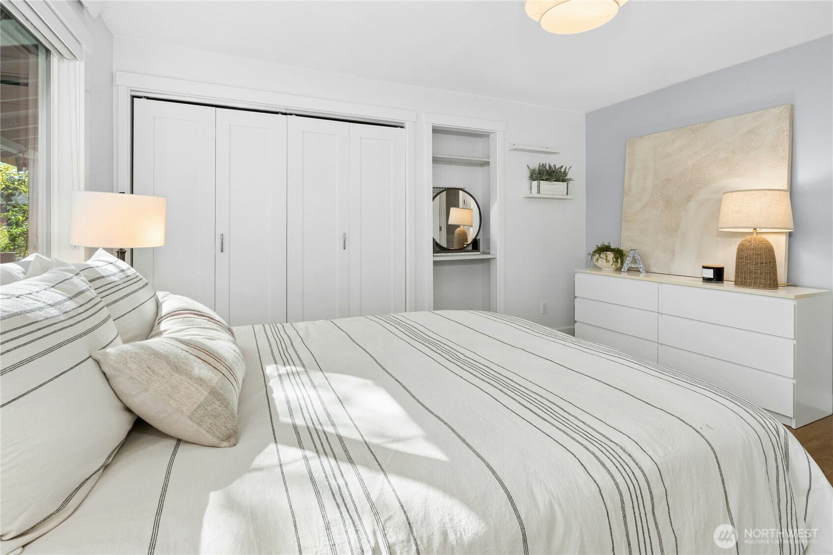 both bedrooms feature large built-in closet organizer systems