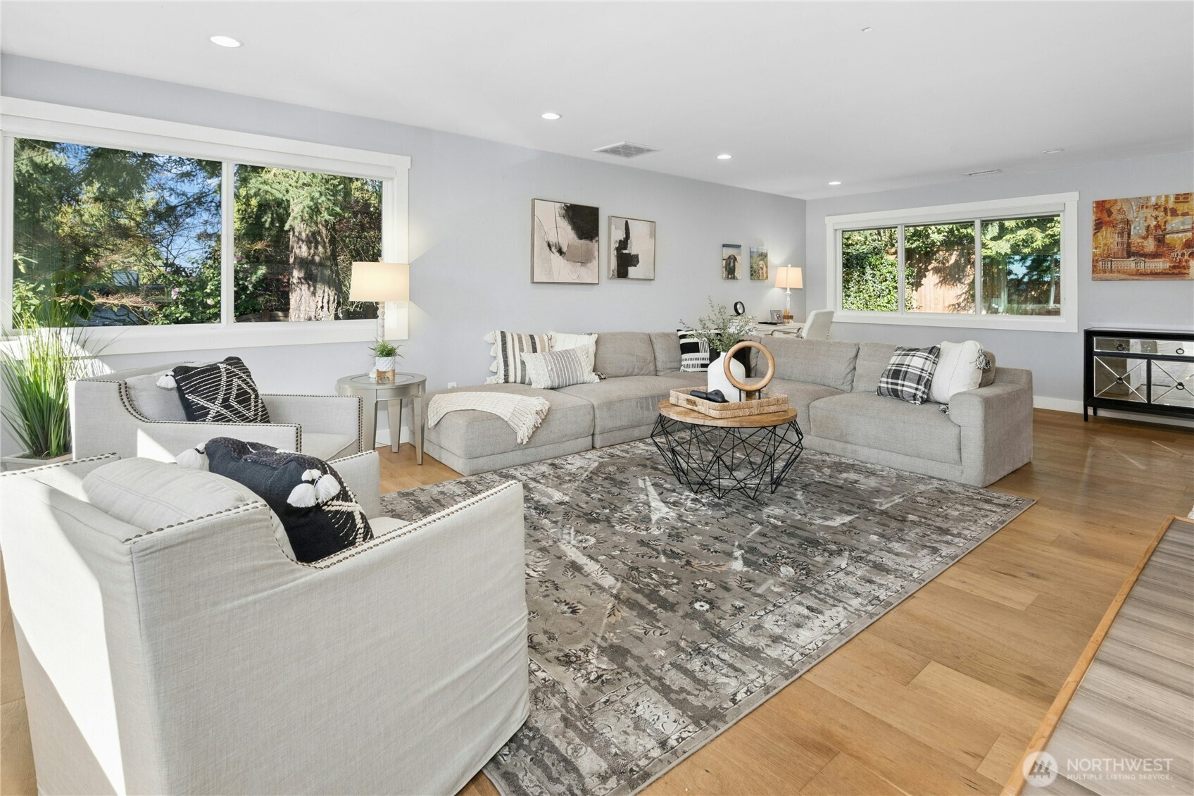 Large windows fill the room with light and the southwest exposure