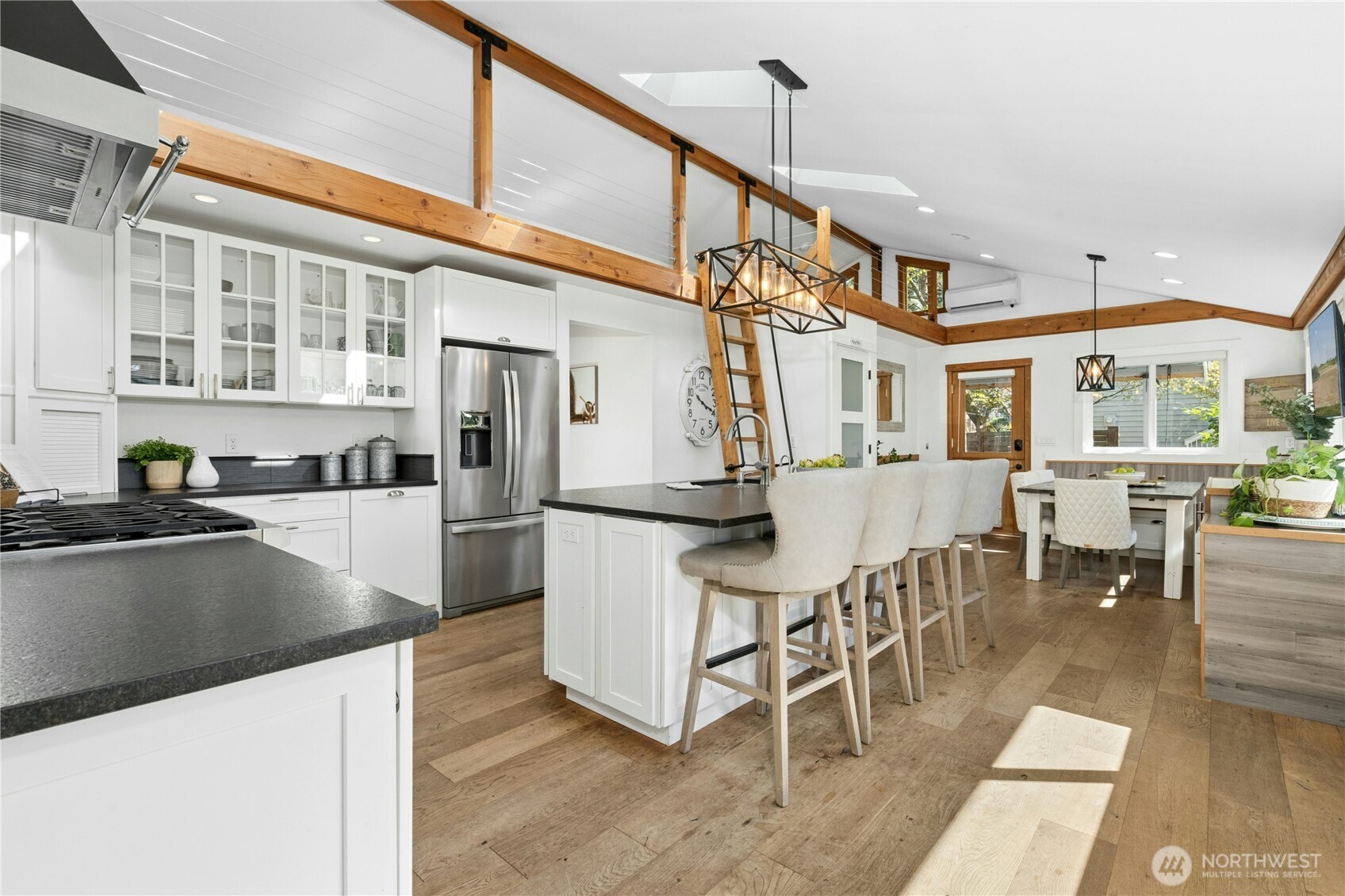 Large, well-appointed kitchen with loads of counter space, an oversized island and storage.