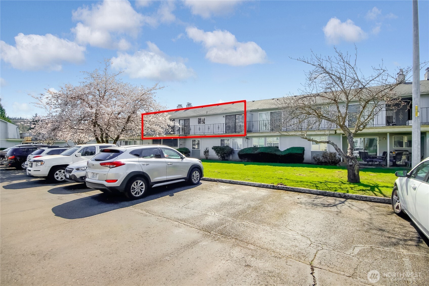 Parking area behind condo unit.