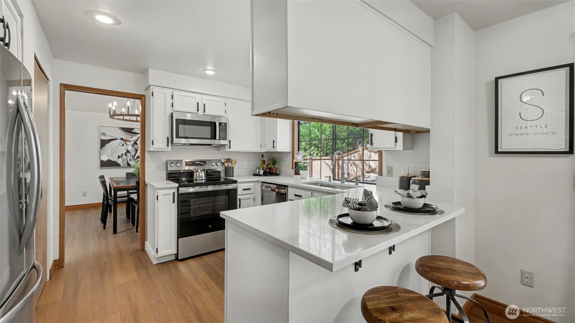 The kitchen  has been recently update with white paint, stainless Steele appliances All appliances remain.