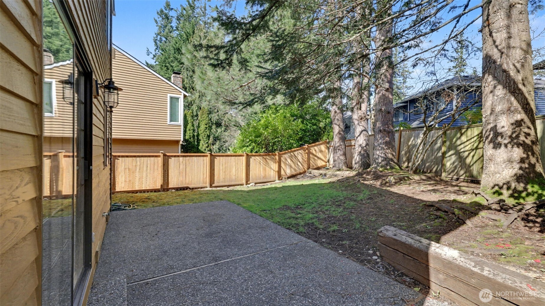 There is a large patio and it has been fully fenced.