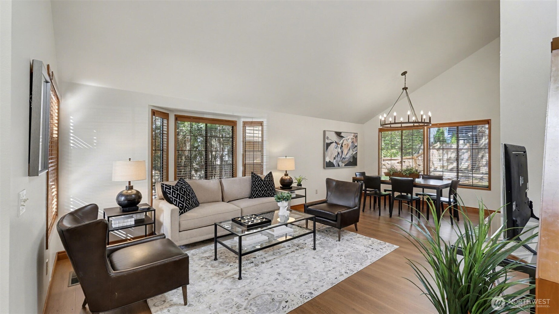 A beautiful vaulted ceiling above the living rom and dining rooms. The entire interior has been recently painted plus brand new wood floors.