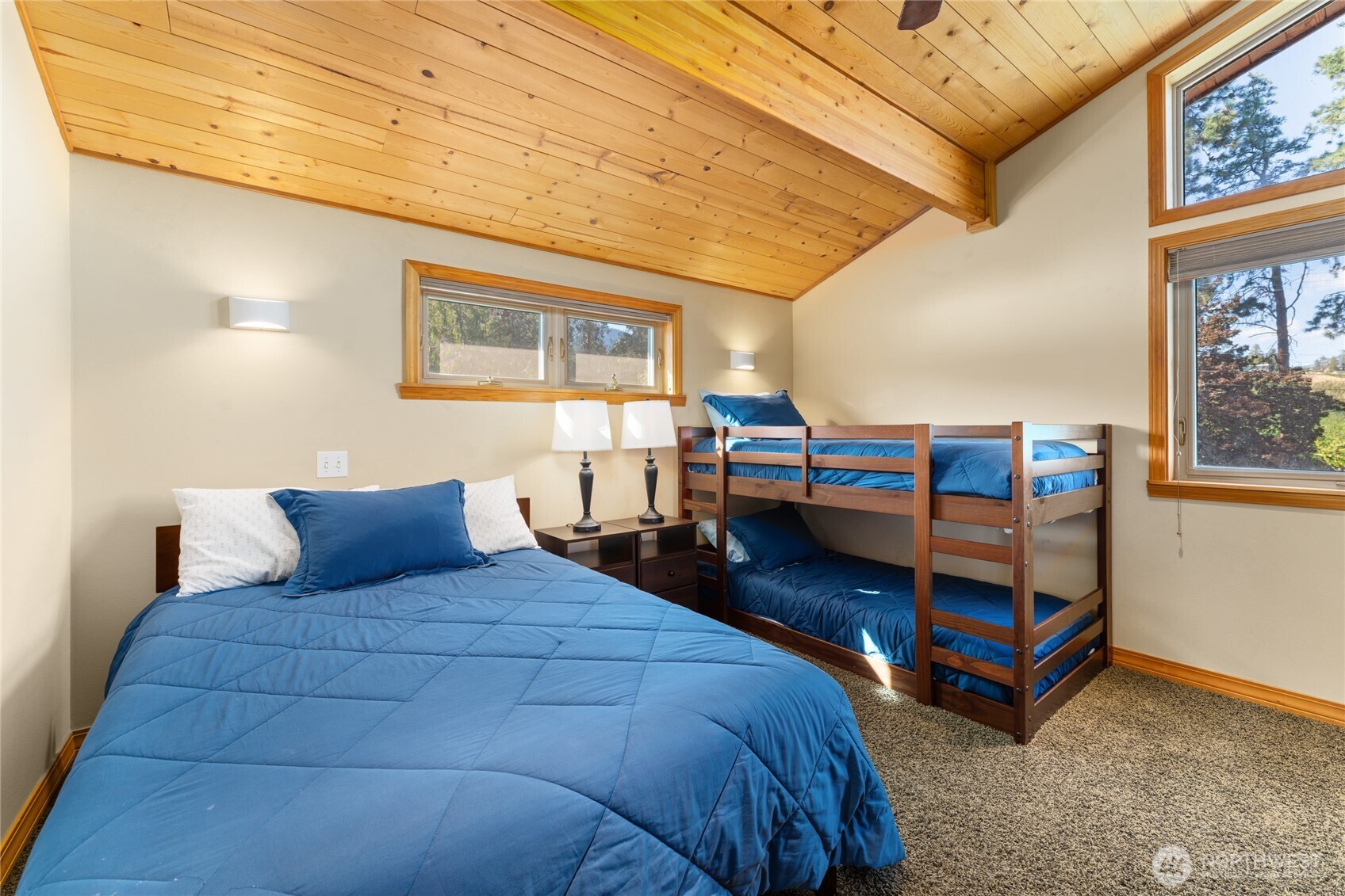 View 1 of upper level bedroom/bunk room w/ adjacent bathroom.