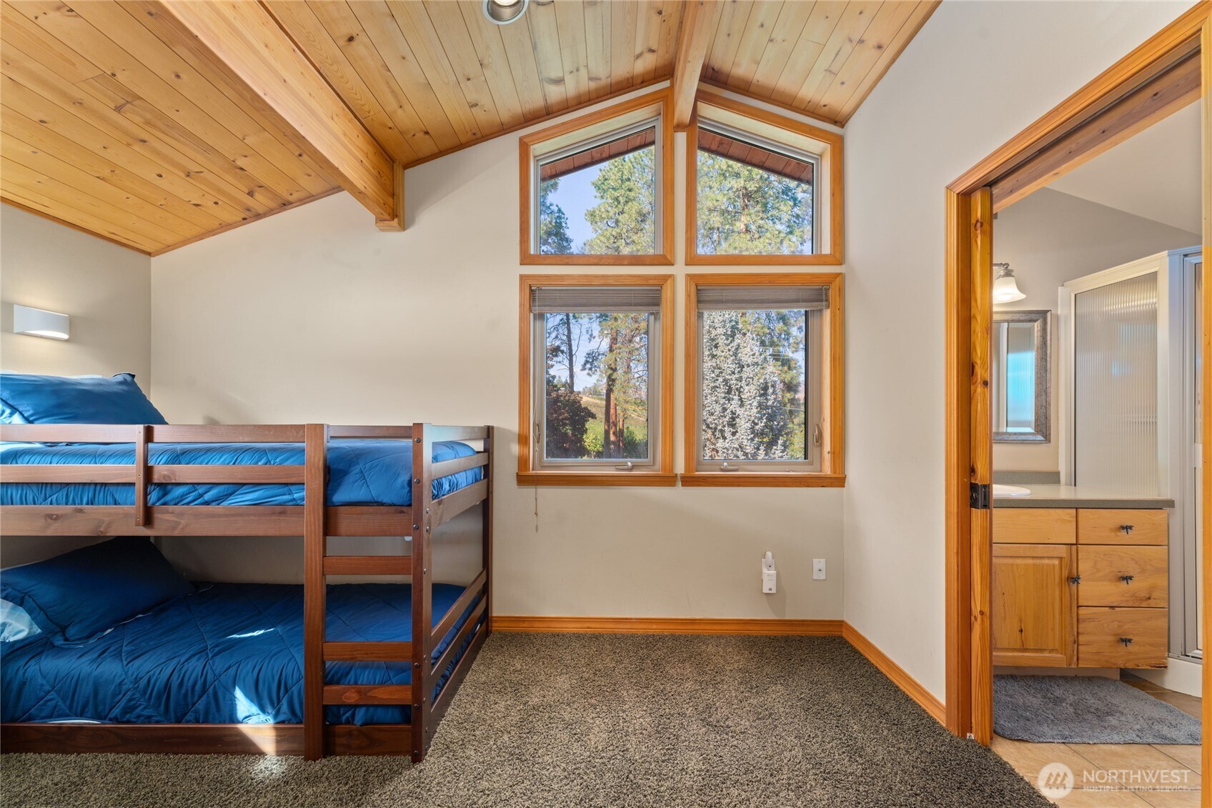 View 2 of upper level bedroom/bunk room w/ adjacent bathroom.