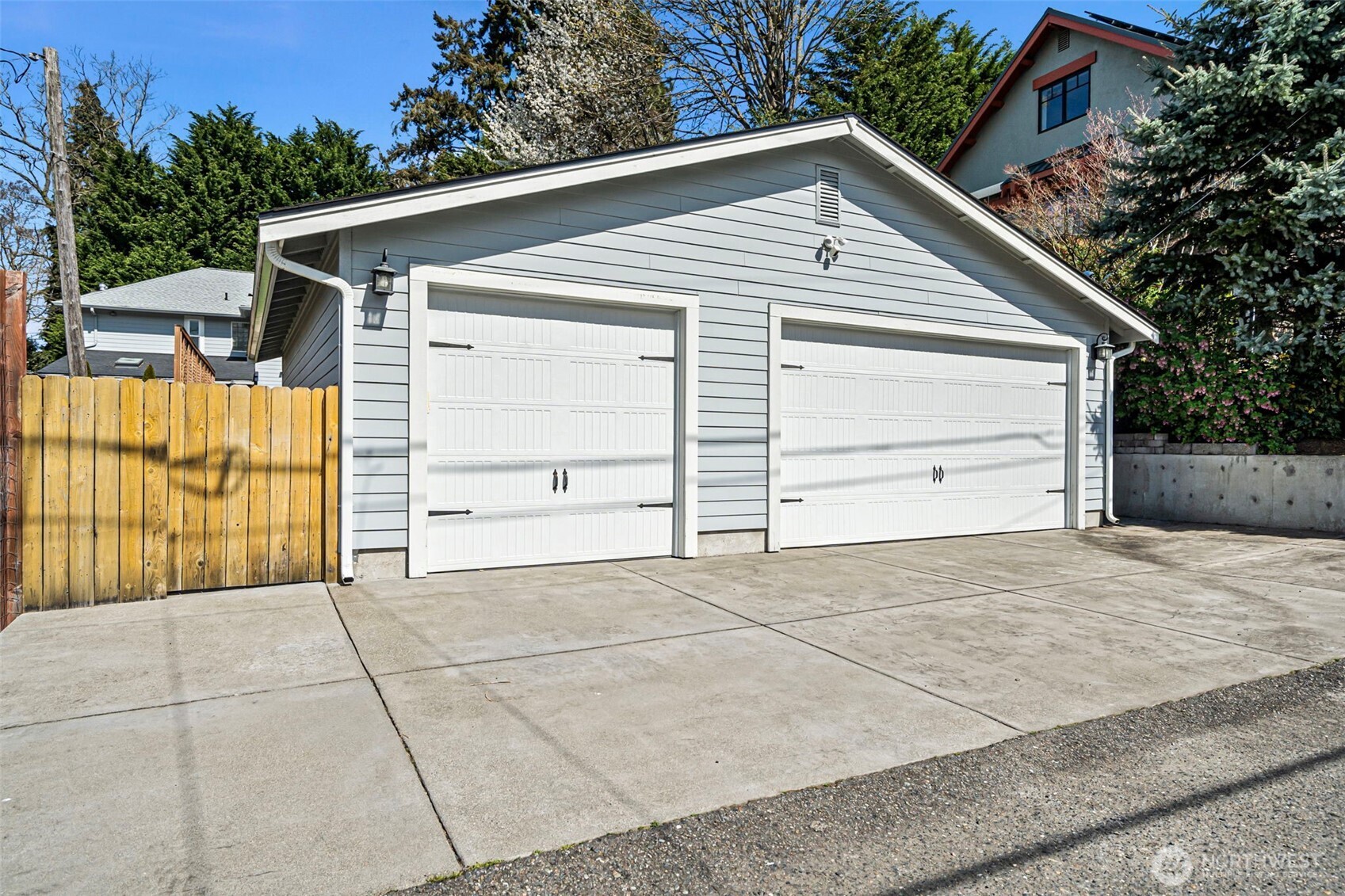 A rare siting in N. Tacoma - a 3-car garage with additional parking to the side.