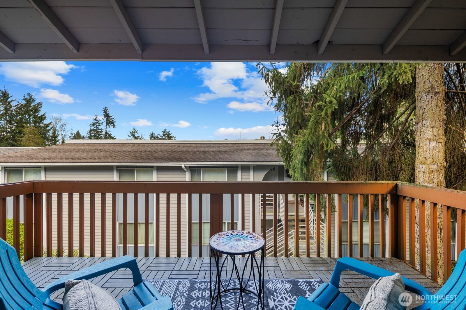Private covered deck with storage.
