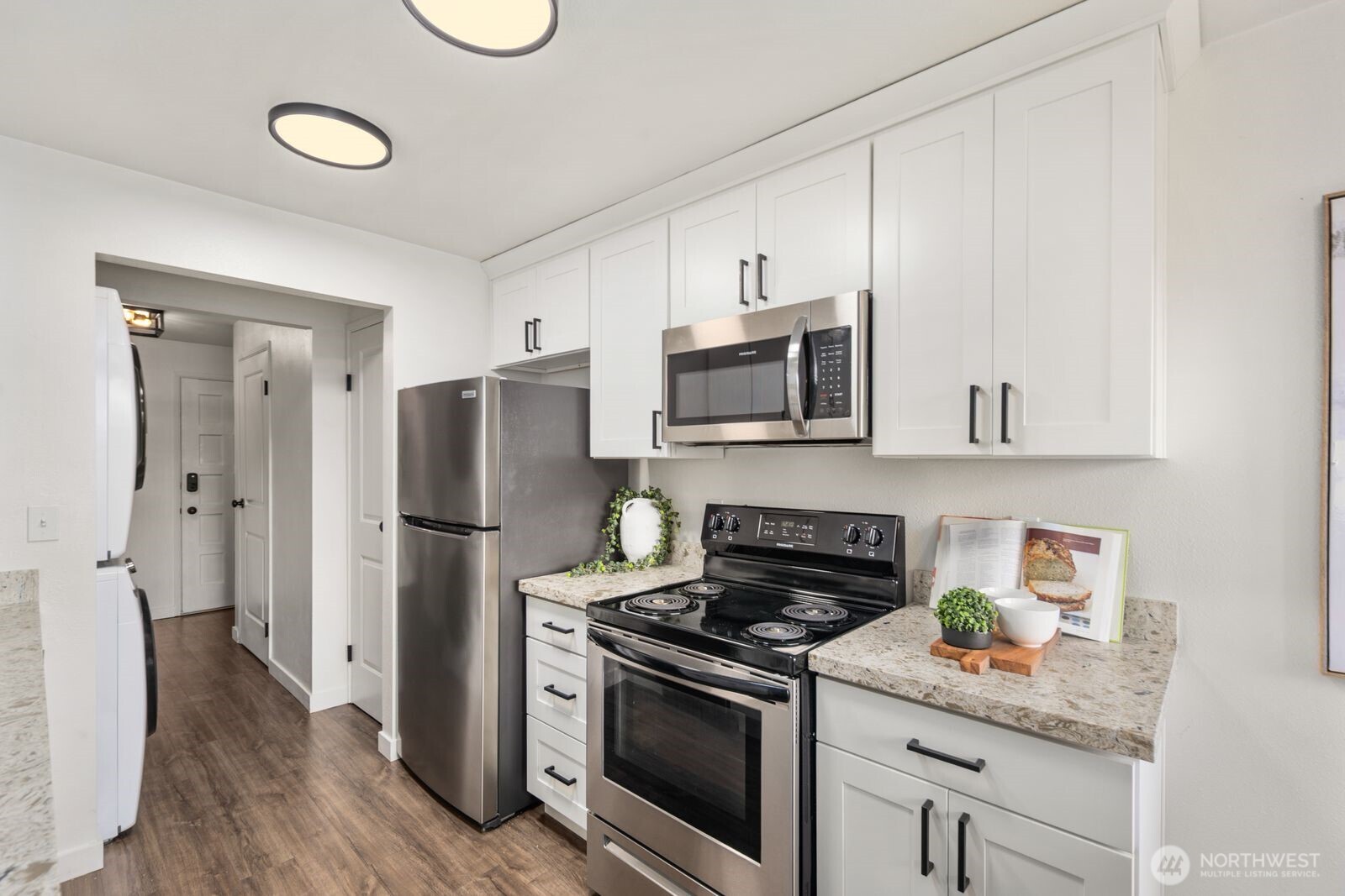 Updated chef's kitchen with stainless steel appliances.