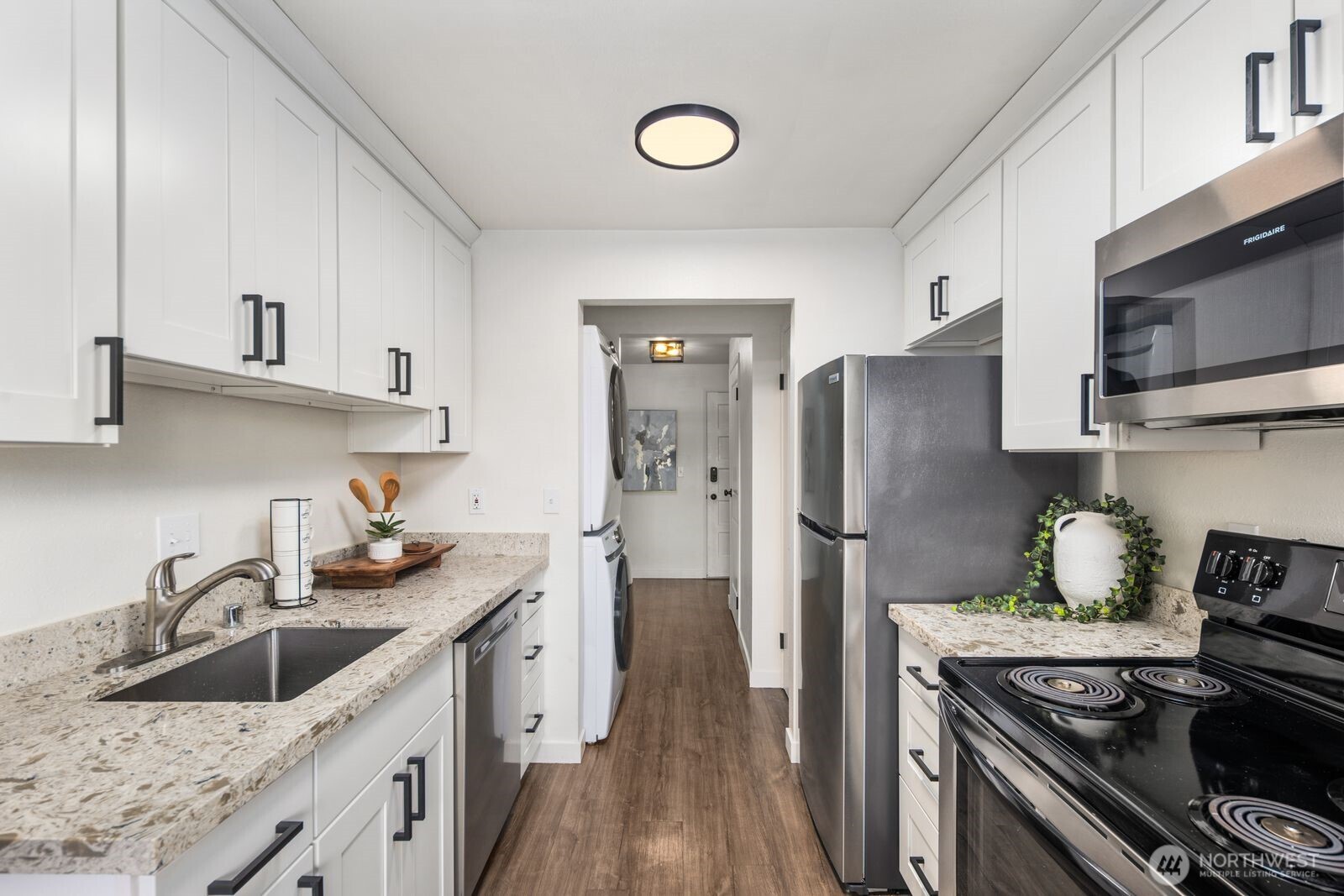 Updated chef's kitchen with stainless steel appliances.