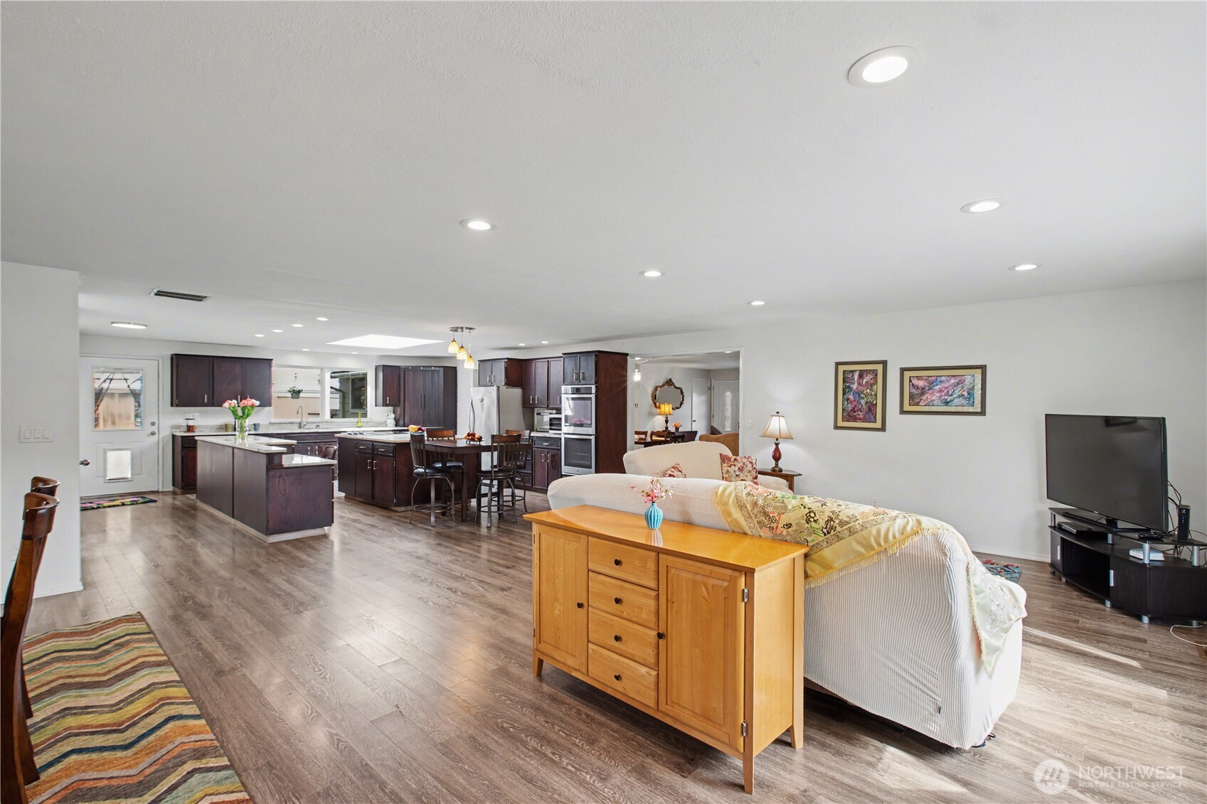Expansive open concept bathed in natural light and enhanced by recessed lighting throughout