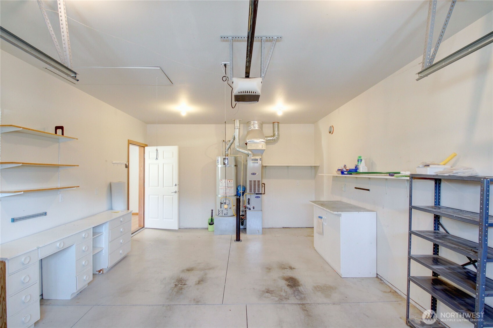 One car garage has storage shelving