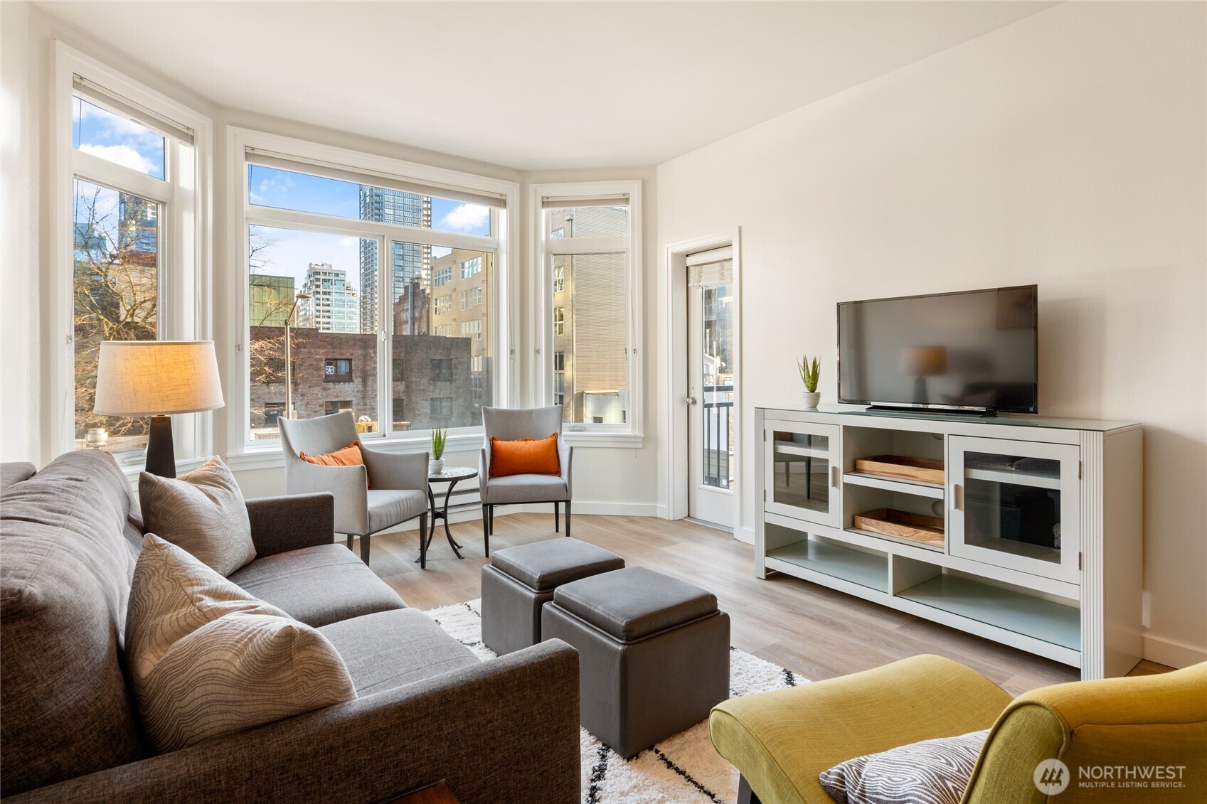 Brand new LVP floors and fresh paint sparkle in the sunlight.