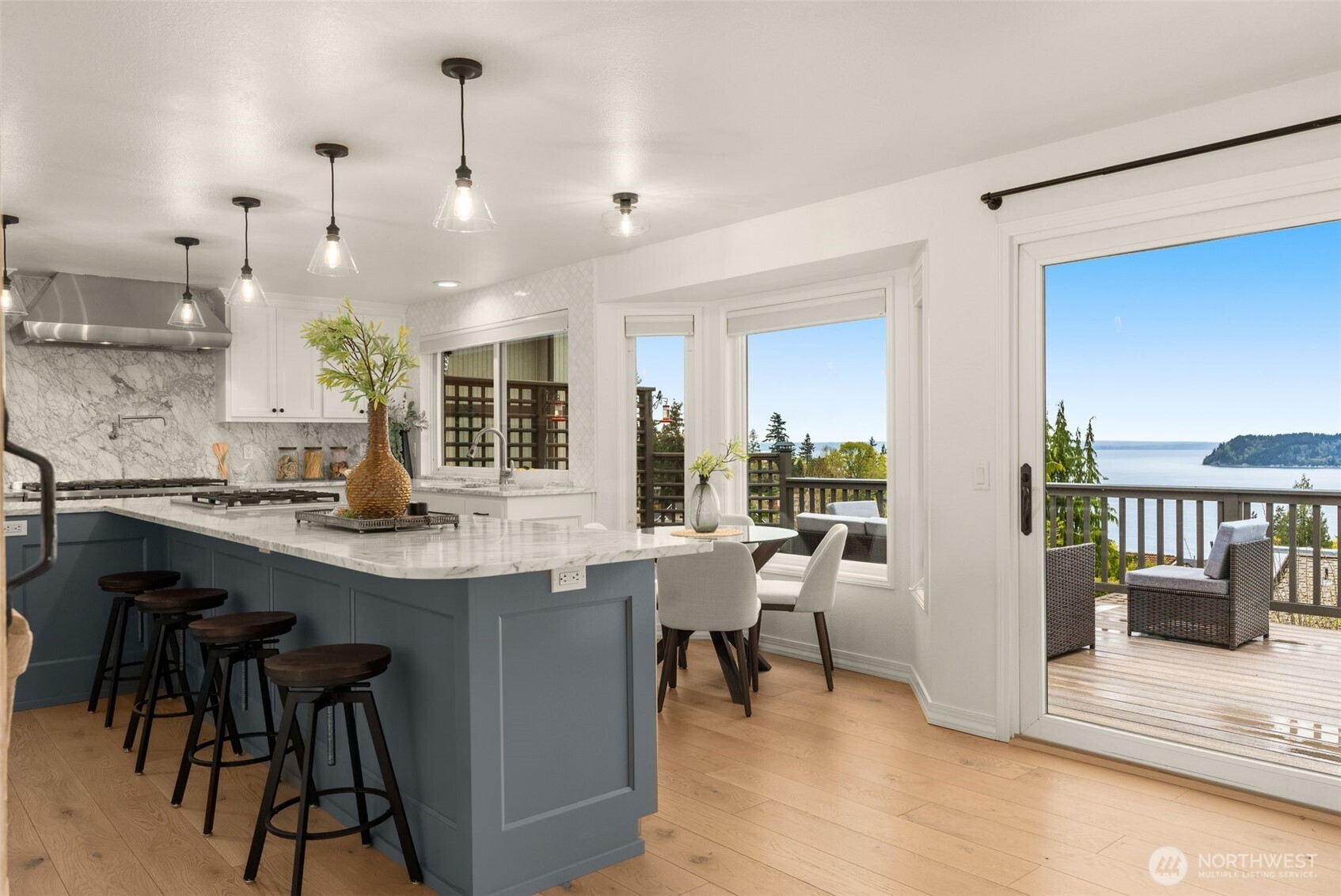 Any time of day bar. Island with power and additional gas cooktop. Eat in kitchen table space.