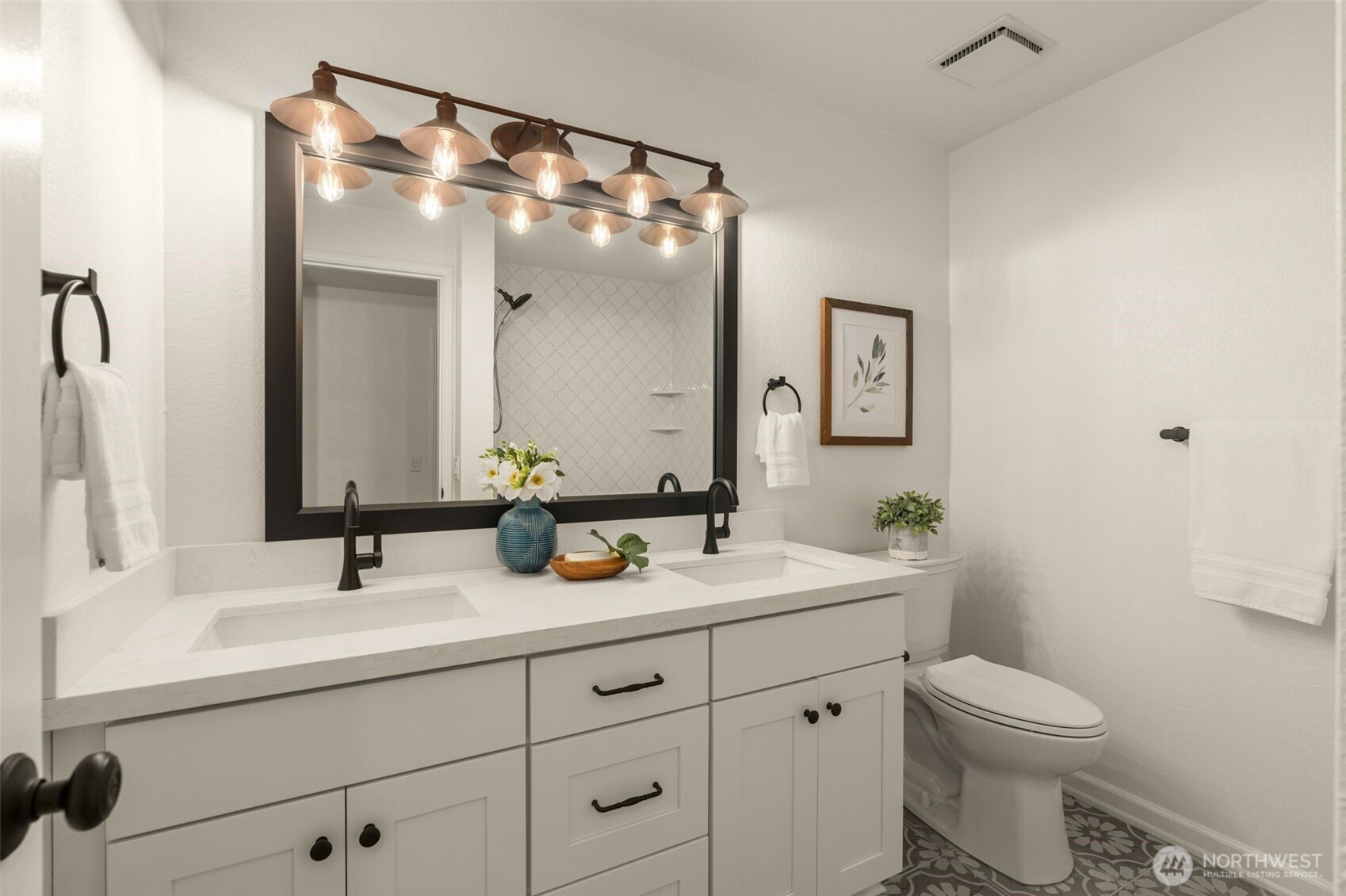 Stylish updated lower level full bathroom. Dual sink vanity, memorable hardware, tile with interest. Personality A+!