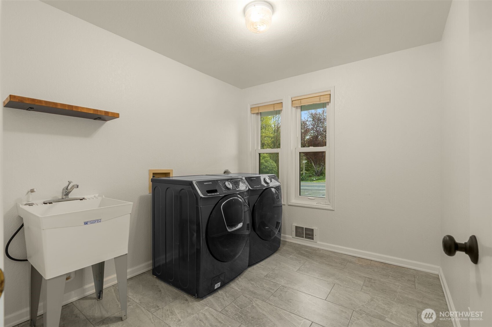 One of two laundry rooms. Lower level.