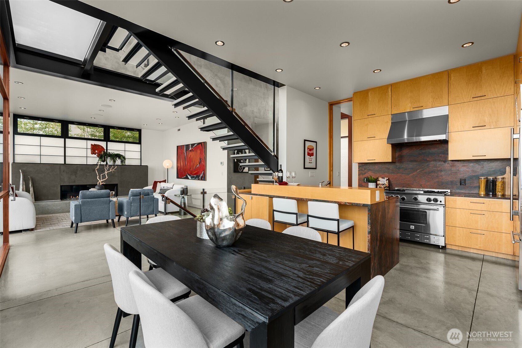 Flowing spaces allow the living, dining, and kitchen areas to feel connected yet expansive