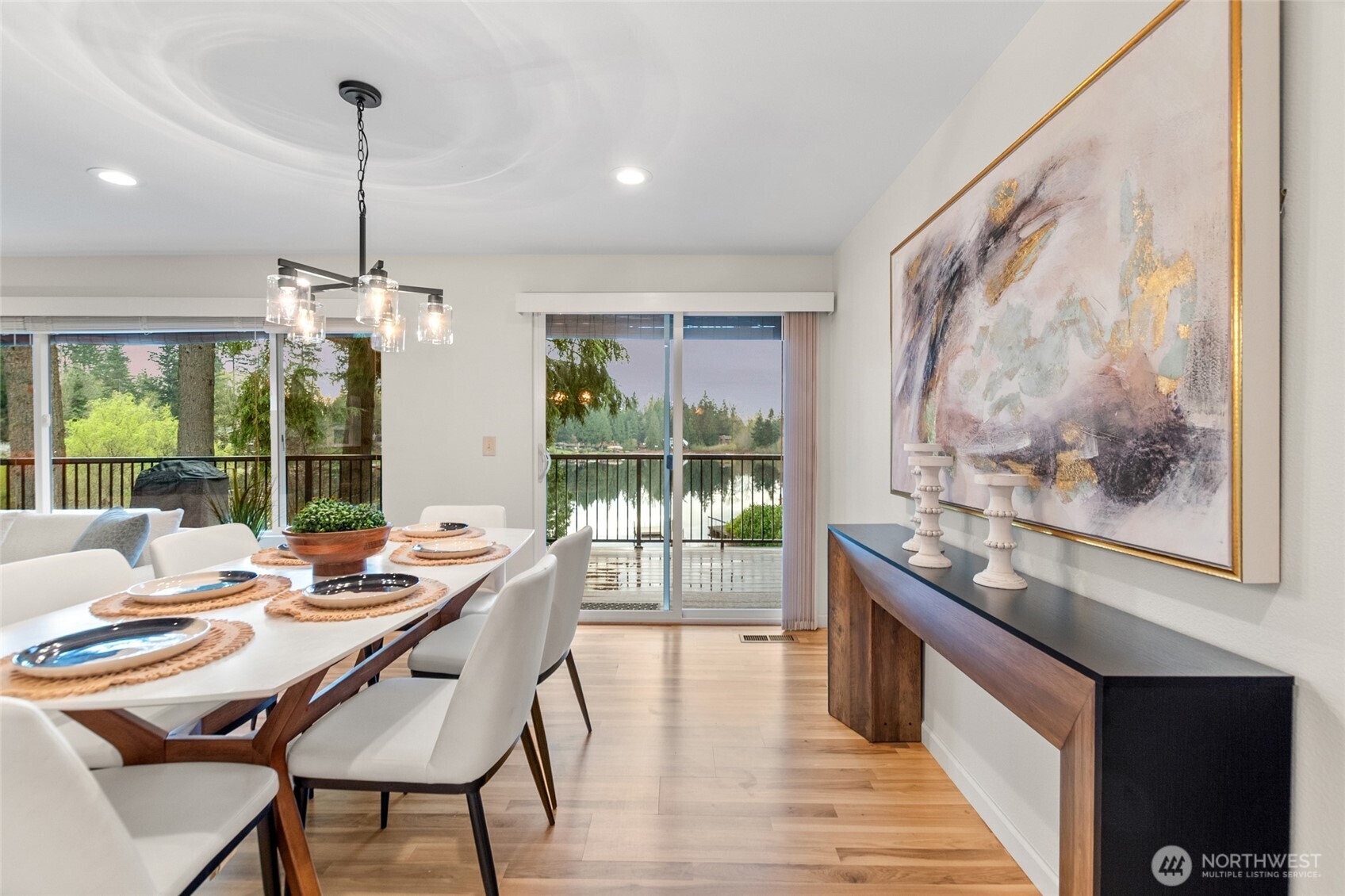 Dining area with direct deck access and beautiful waterfront views of Echo Lake