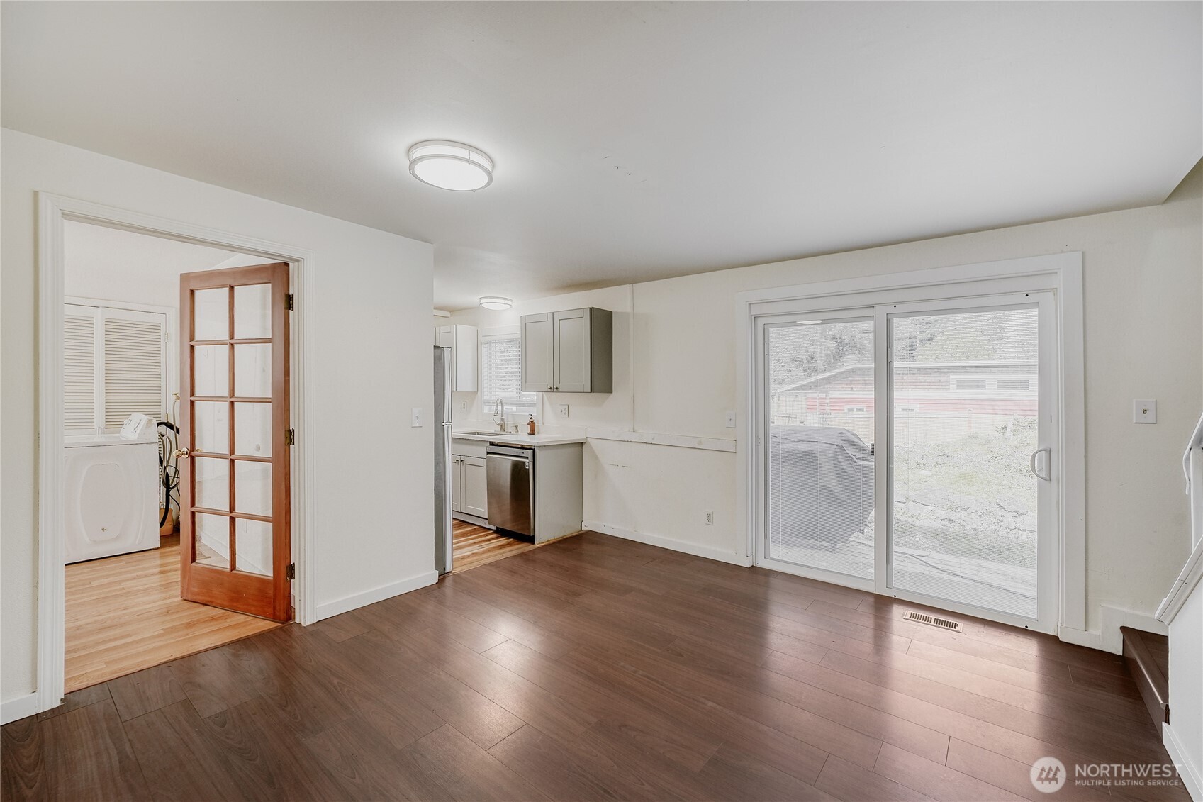 Bright and functional kitchen featuring sleek quartz counters and stainless steel appliances in this beautifully updated 4-bedroom home. Open-concept design flows seamlessly into the living and dining areas — perfect for everyday living and entertaining in Redmond’s sought-after Union Hill neighborhood.