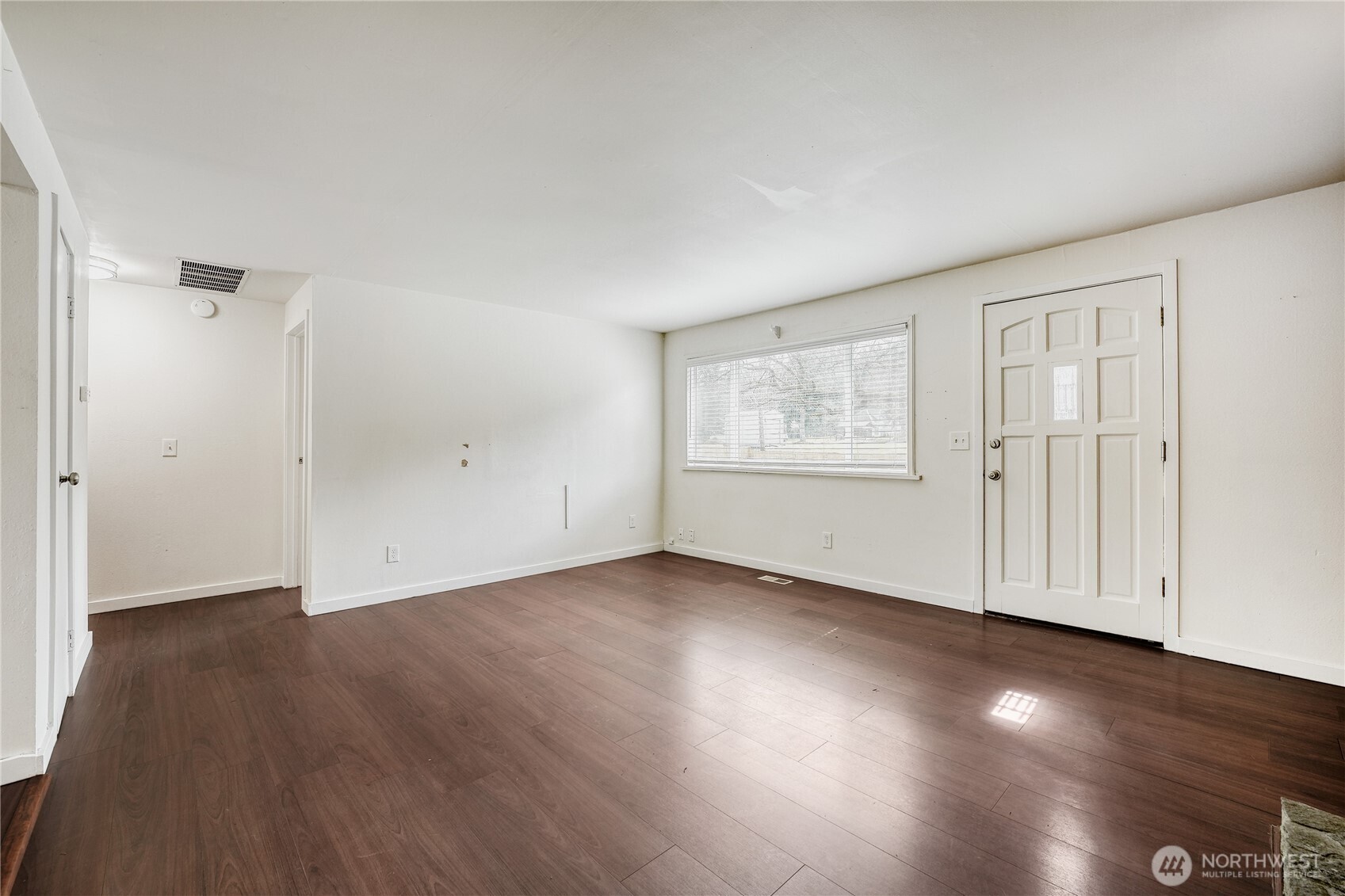 Cozy up to the elegant wood-burning fireplace in this large living area. Paired with modern LVP flooring, it anchors the open-concept space perfectly in this 1,690 sq ft Union Hill home.
