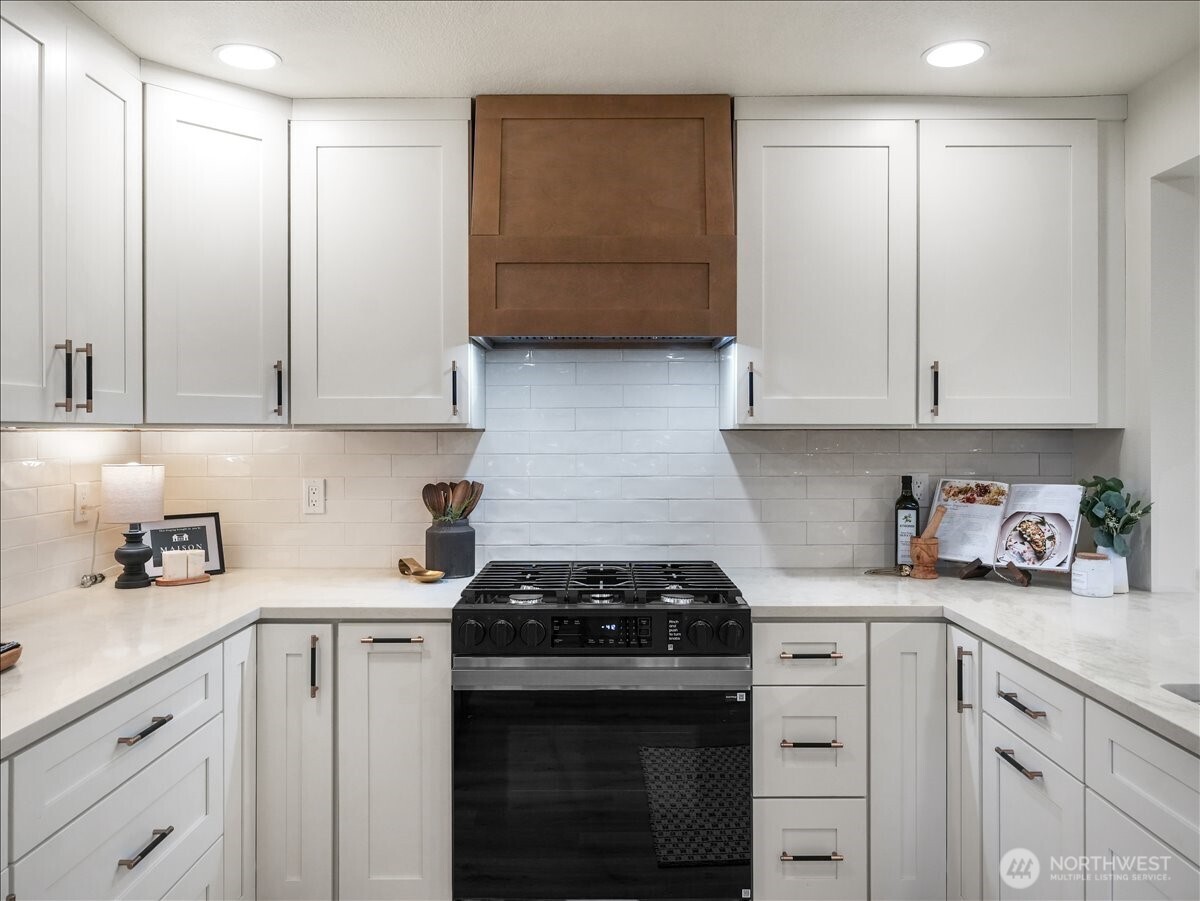 Kitchen cabinets, stove and hoodvent