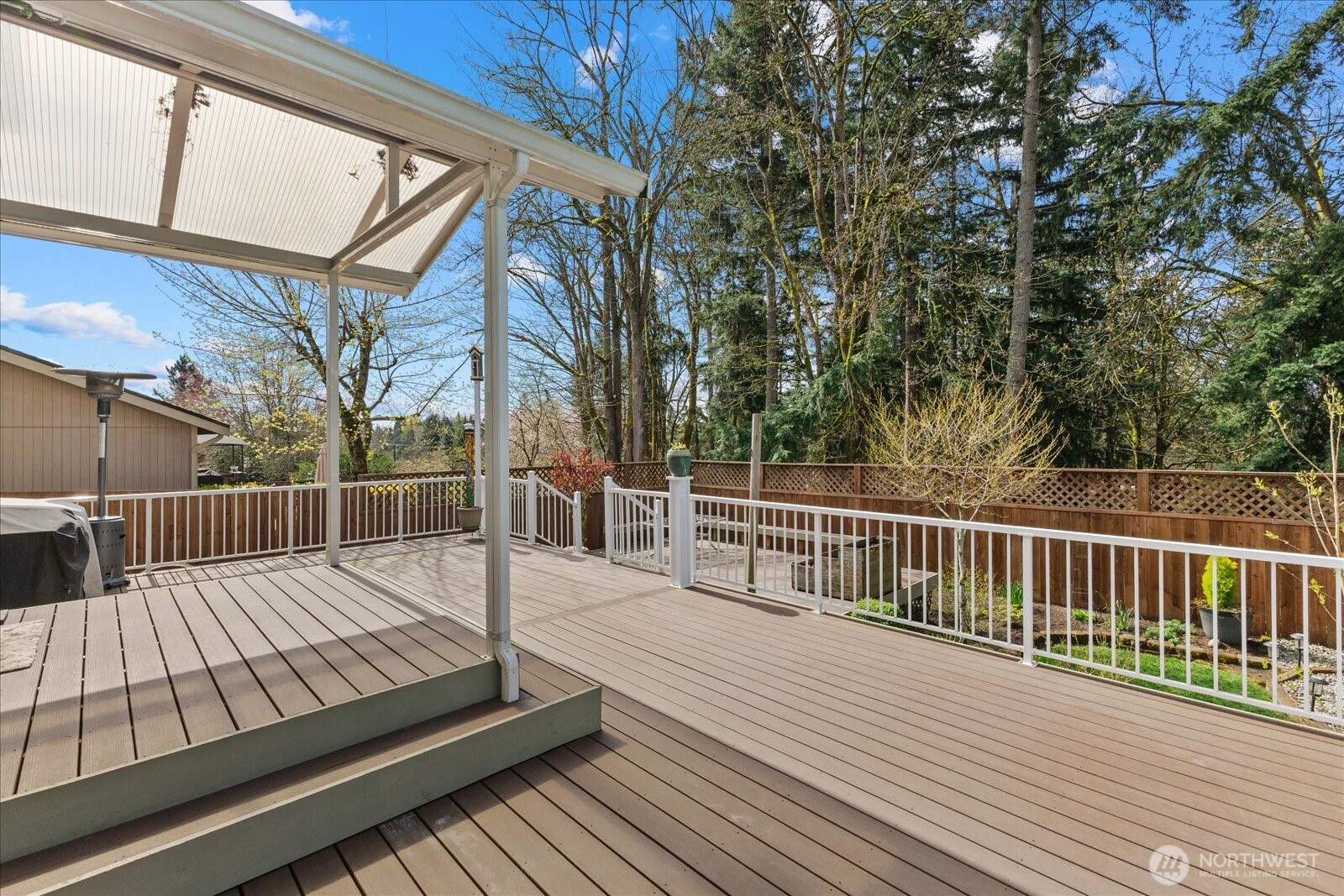 Durable AZEK deck with awning for year-round enjoyment