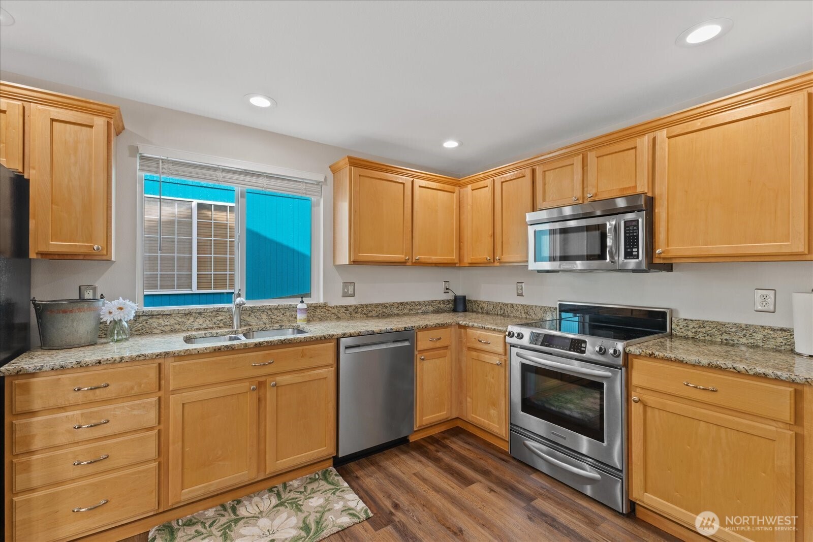 Kitchen offers abundant cabinetry and generous prep space for effortless cooking and storage