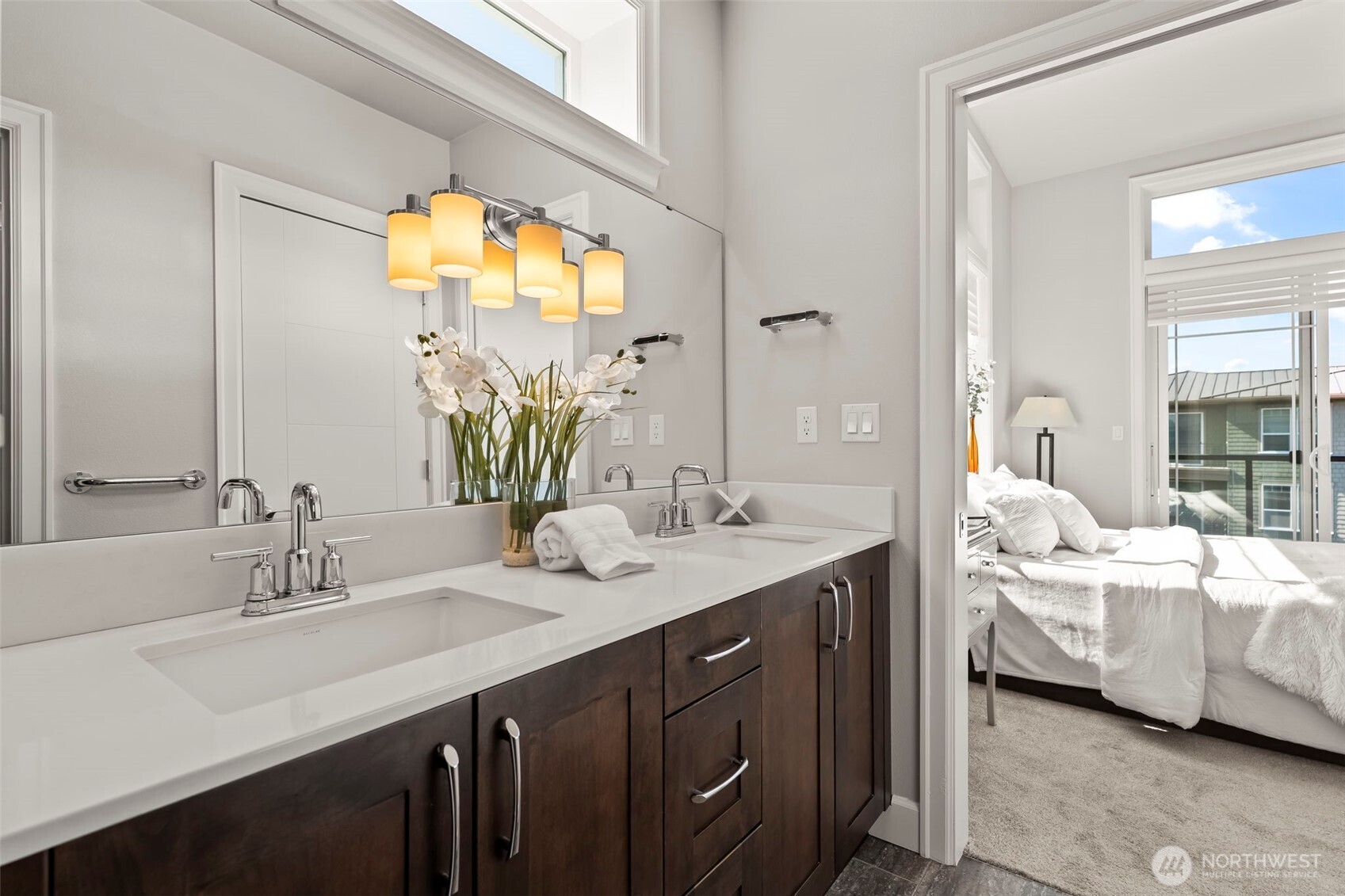 Spa-quality en-suite with double sinks, quartz counters, soft close cabinetry