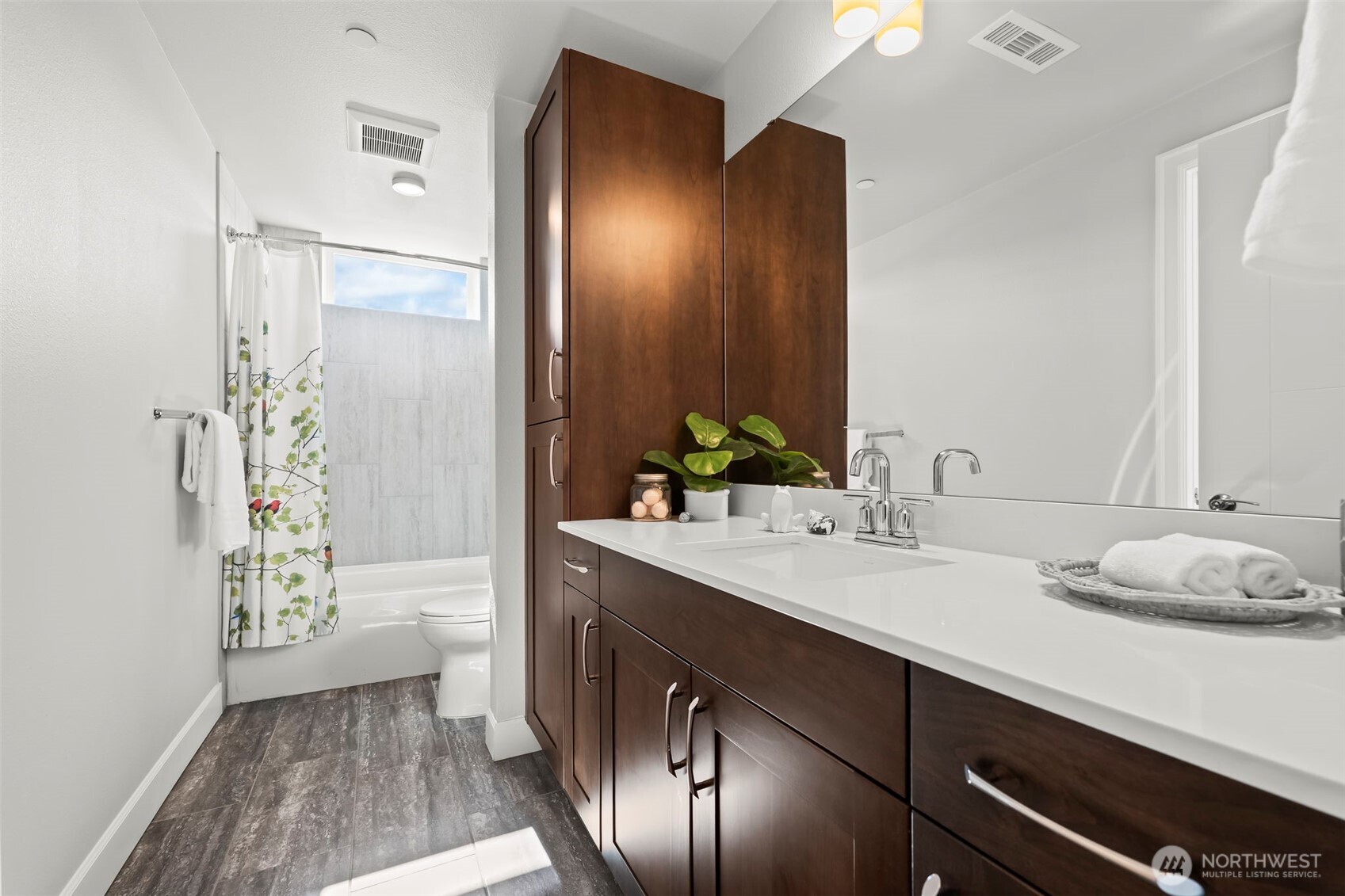 FULL bath off the main entry with pocket door access from the secondary bedroom