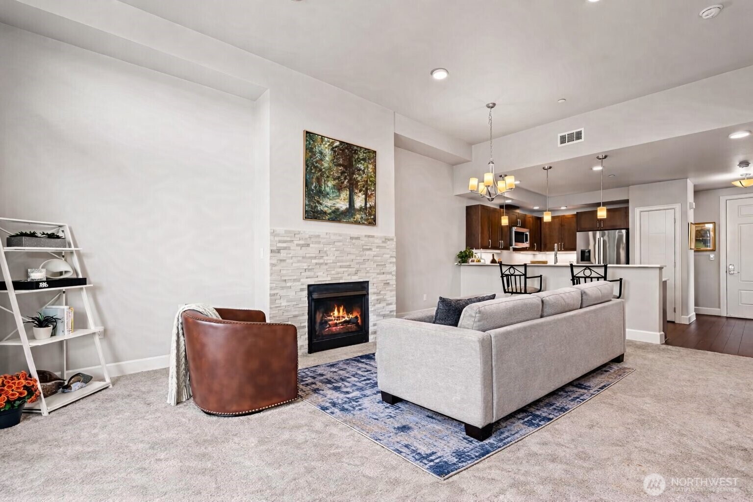 Cozy up on the couch by the gas fireplace **couch virtually staged**