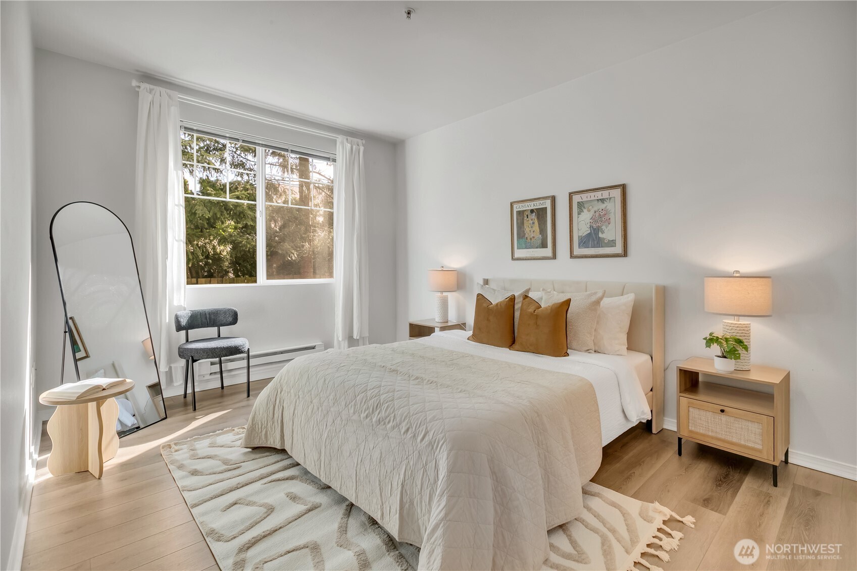 Primary suite offer ample room for bed and furniture and a large window provides plenty of natural light.