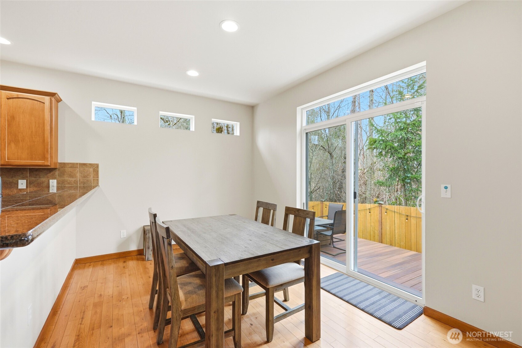 Dining room opens from kitchen to the private patio.