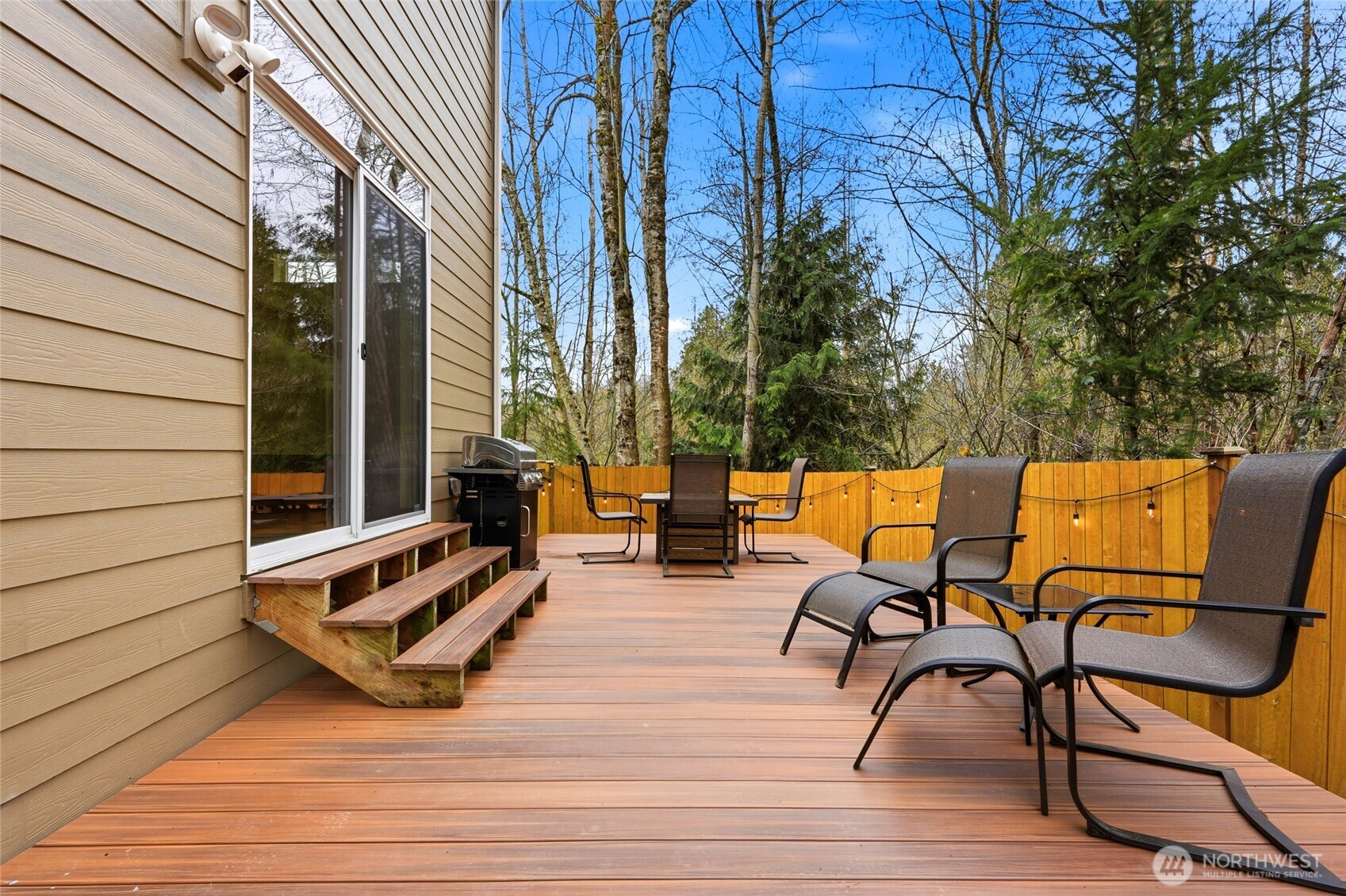 Slider opens directly to an oversized deck and patio.