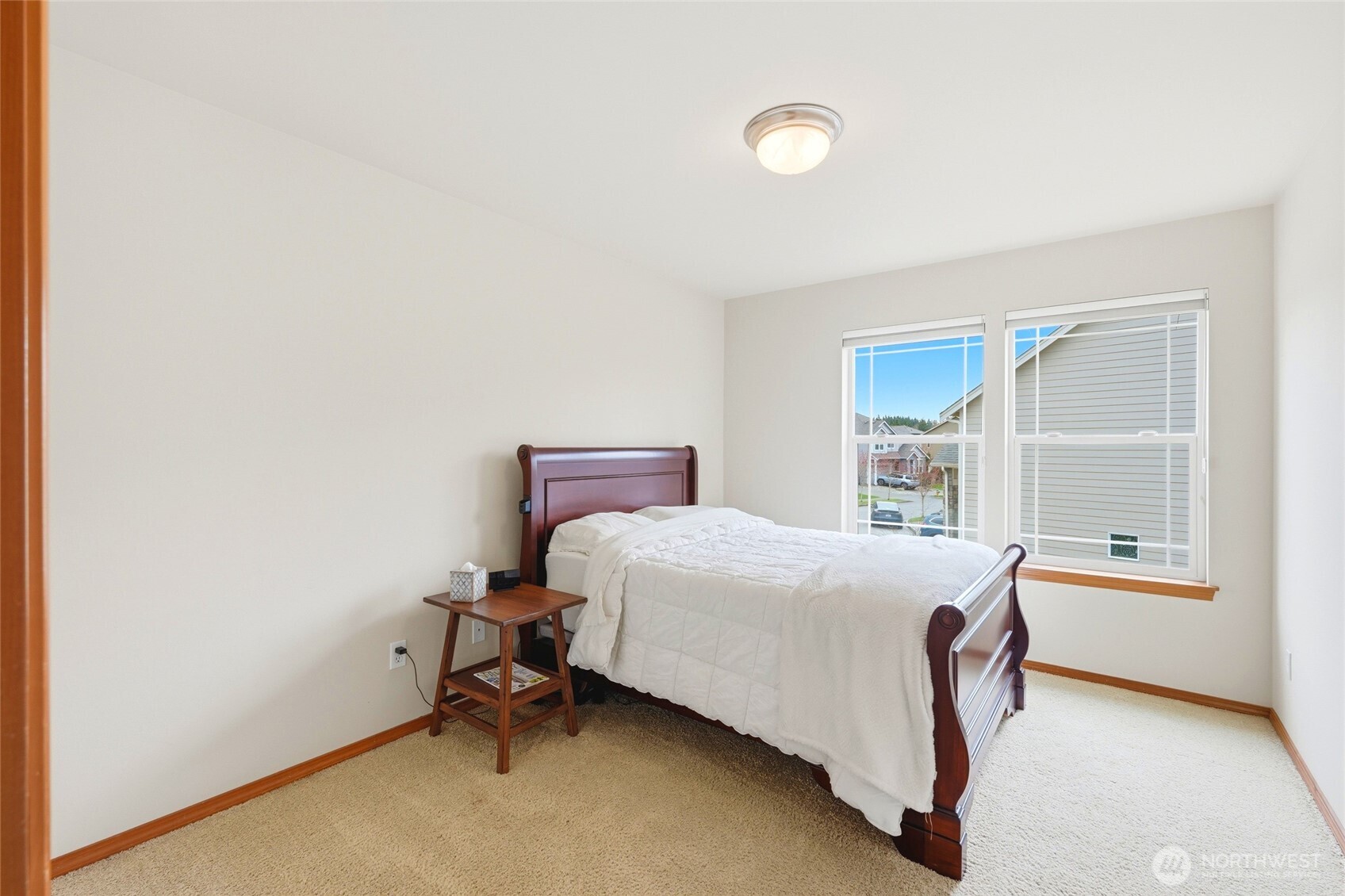 Second bedroom. Upstairs has three additional bedrooms, each with oversized closets.