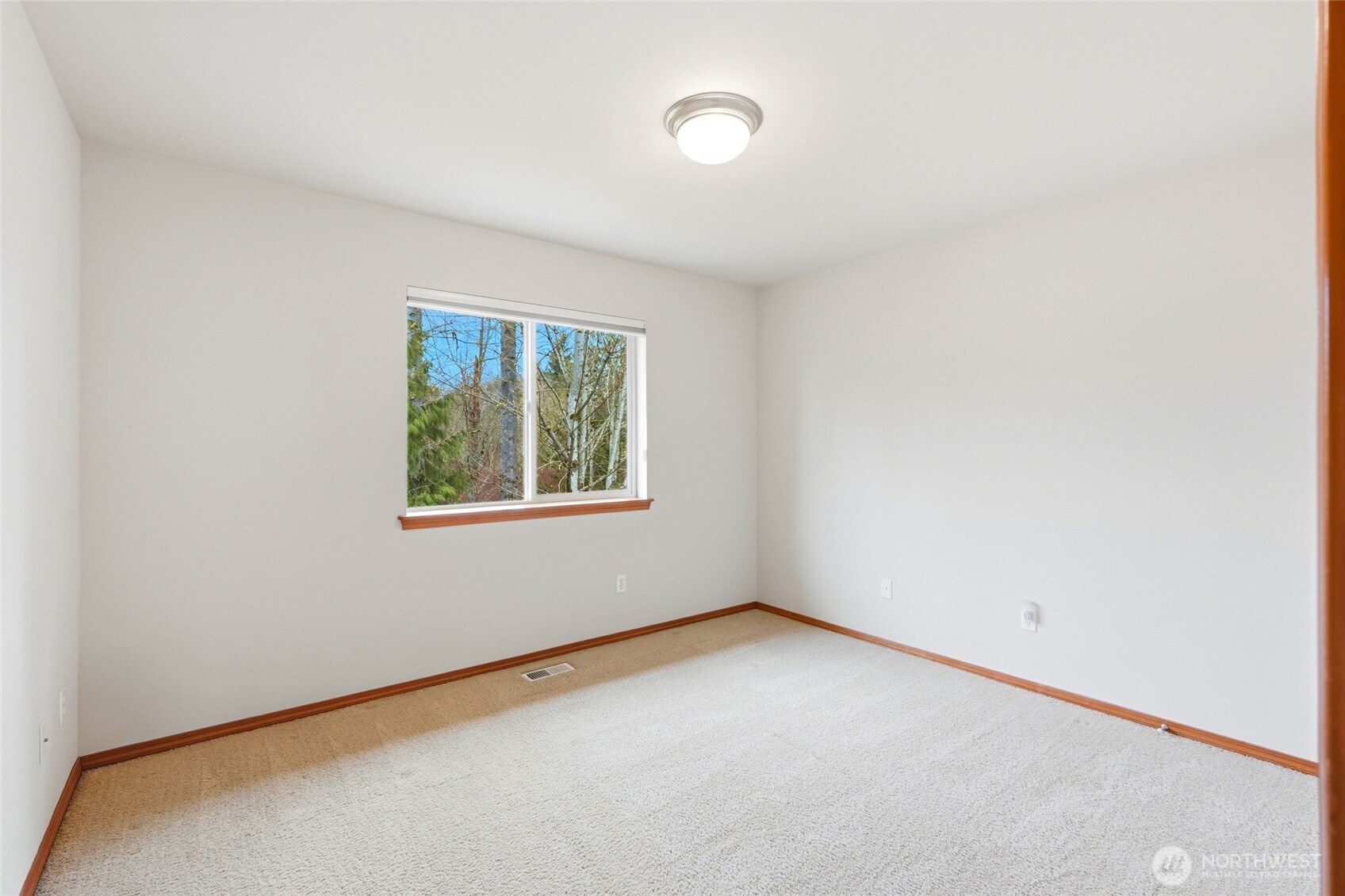 Fourth bedroom. Upstairs has three additional bedrooms, each with oversized closets.