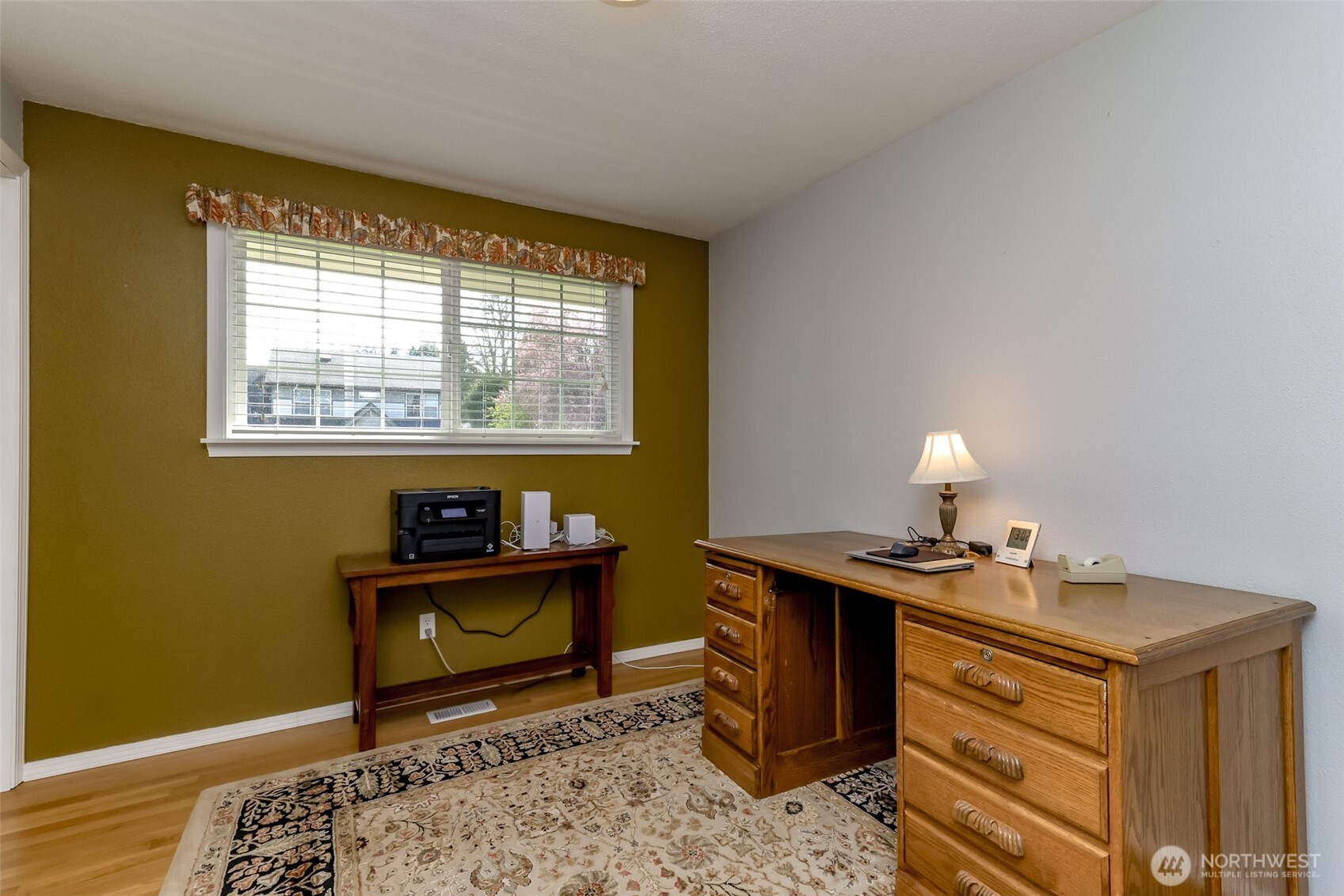 Second of three bedrooms on the main floor - currently being used as an office space.