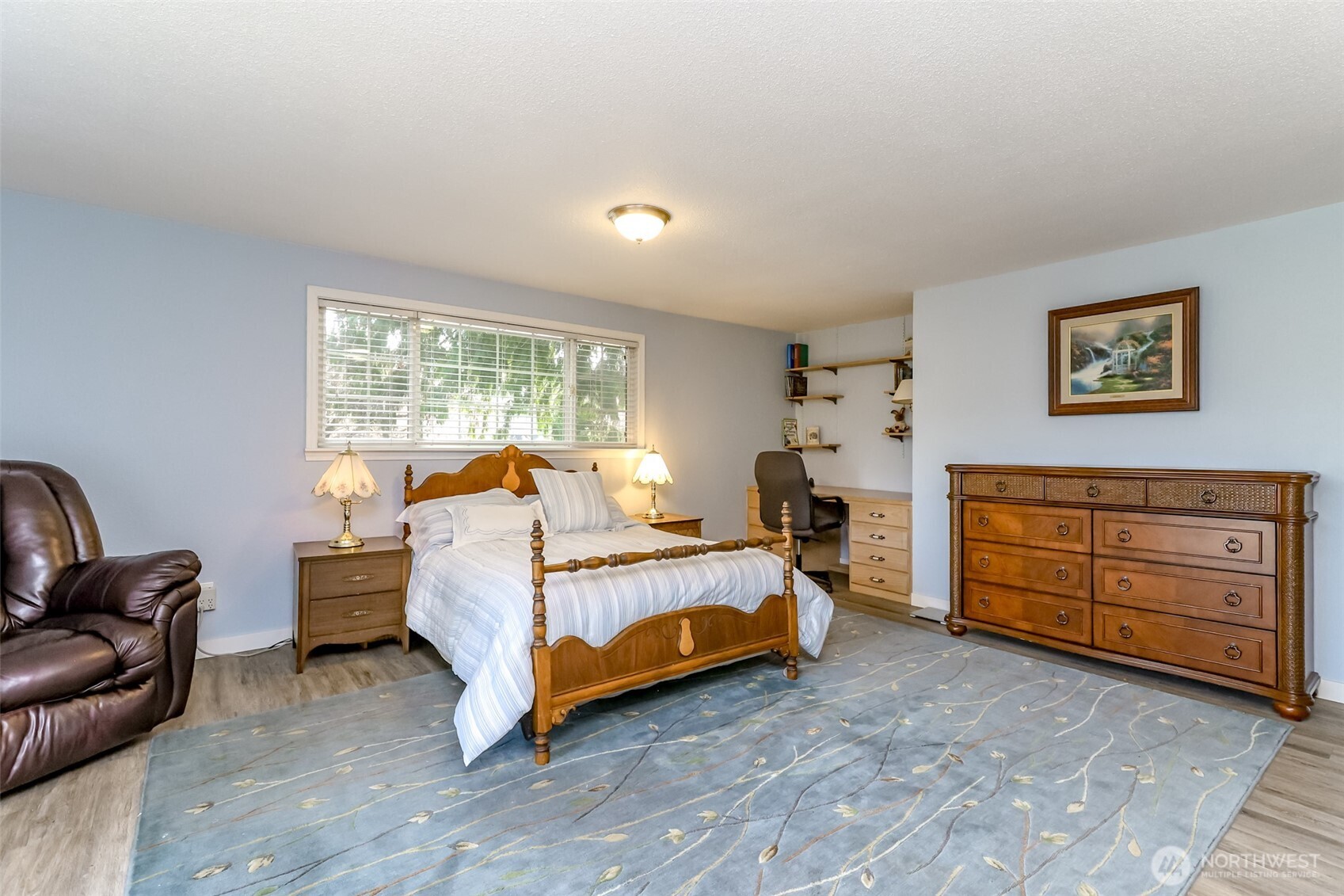 The large primary bedroom with walk in closet