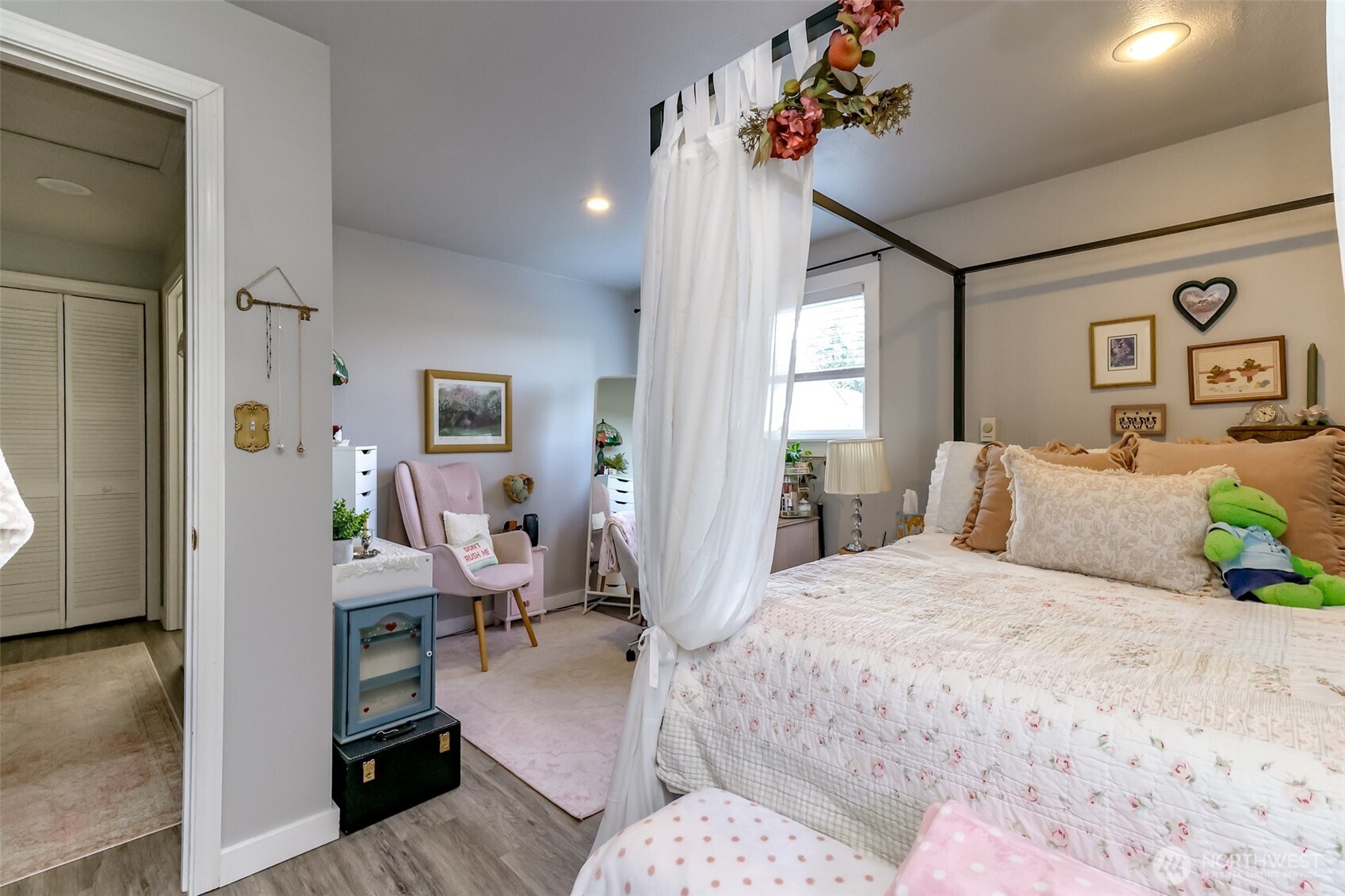 The oversized deck overlooks a lush garden space, all neatly enclosed by a fence. A dedicated chicken area offers a charming, functional l setup for fresh eggs. The combination creates an inviting outdoor living are perfect for entertaining or enjoying country life comforts