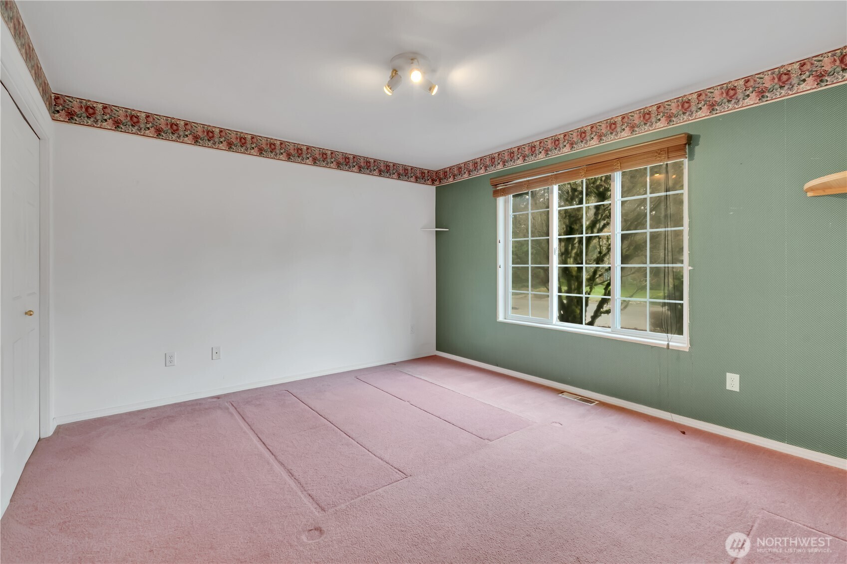 Main floor bedroom with attached 3/4 bathroom