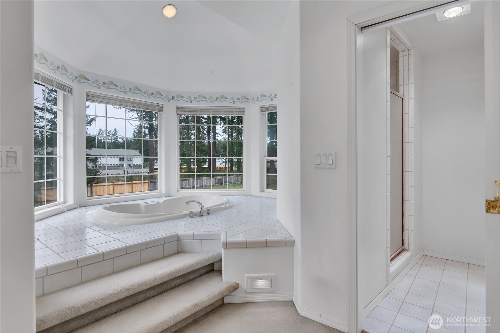 Sunny, elegant space for relaxation or re-imagine this primary bathroom space