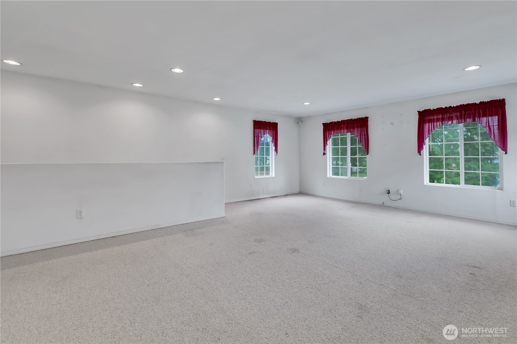 Enormous bonus room or media room. Rear staircase leads down to the family room