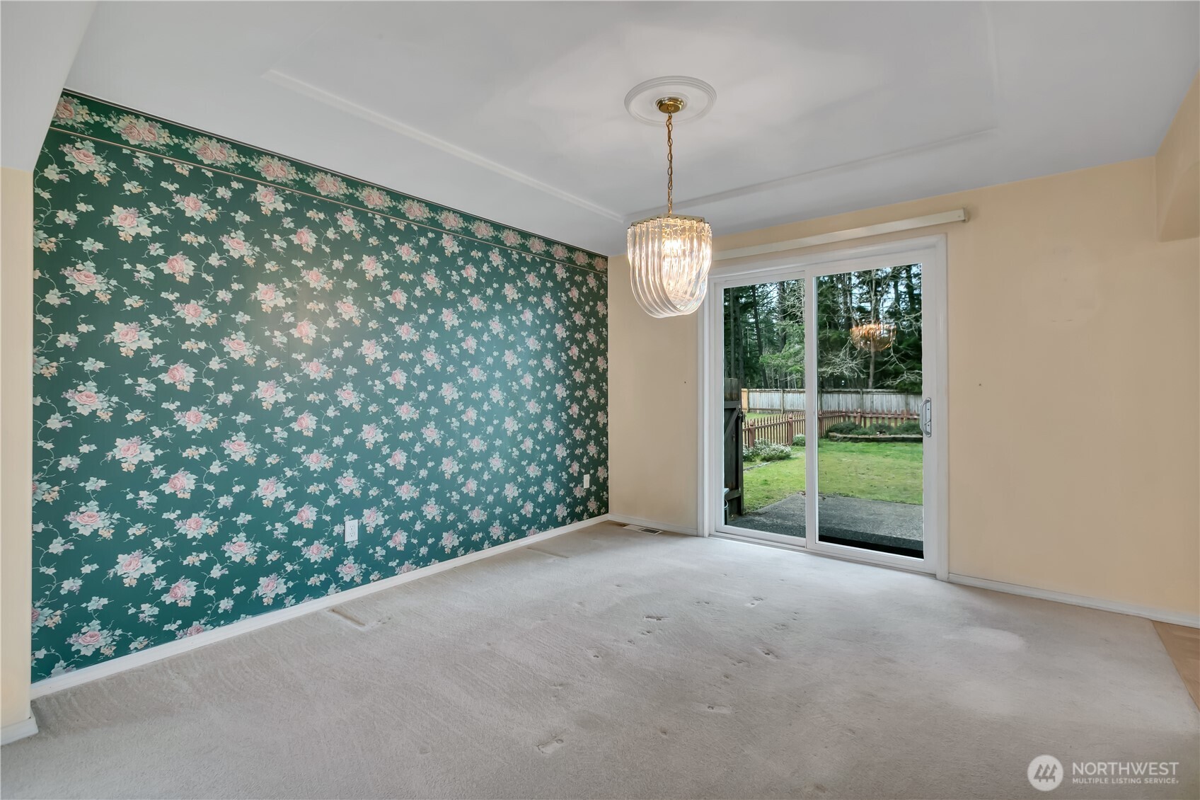 Formal dining room with sliding glass door access to the back patio