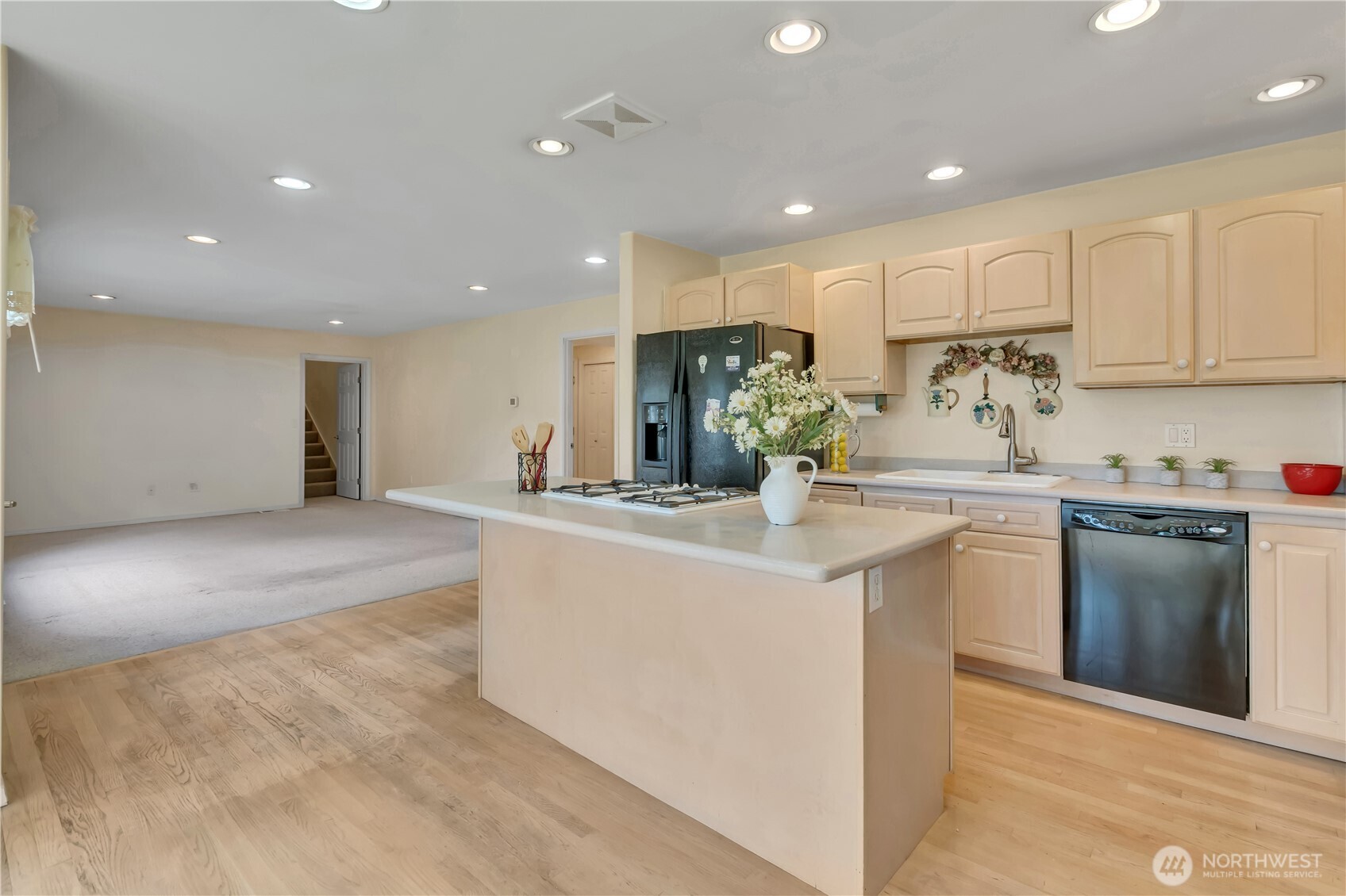Kitchen and nook looking into the rear family room