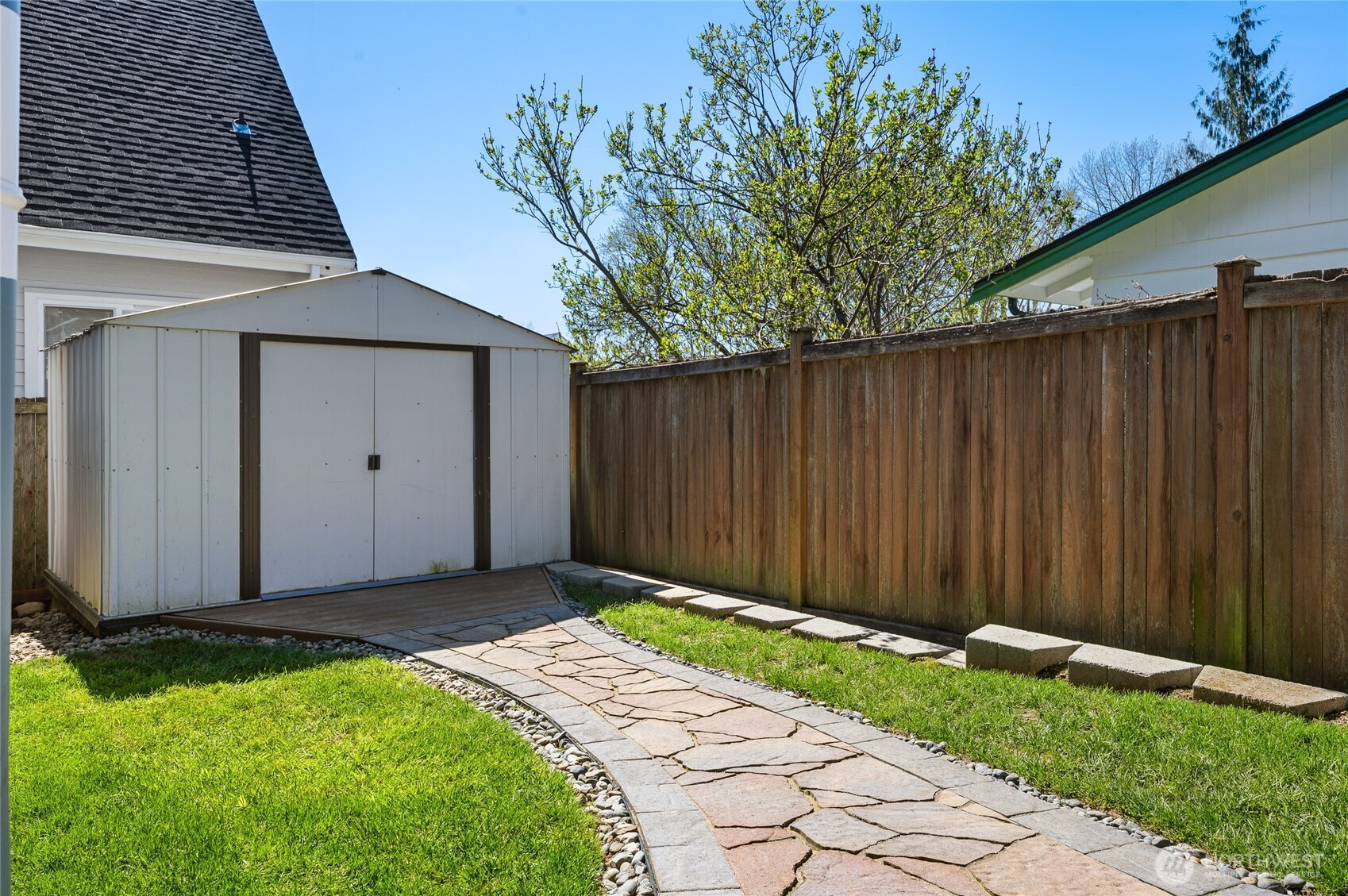 Additional storage in the spacious attic and in this outdoor shed.