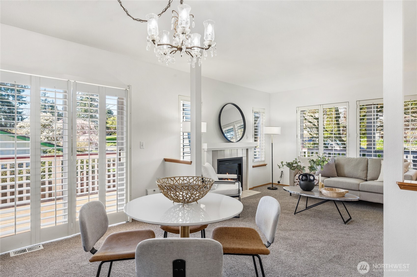 Dining area flows seamlessly to the outdoors to enjoy this lovely spring days! Plantation shutters throughout main level.