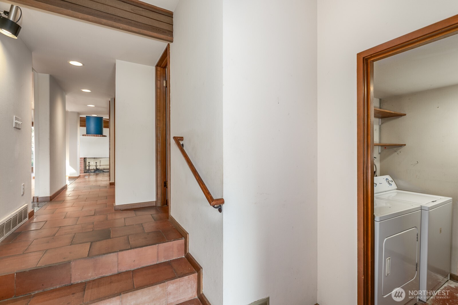 Entrance with utility room on the right.