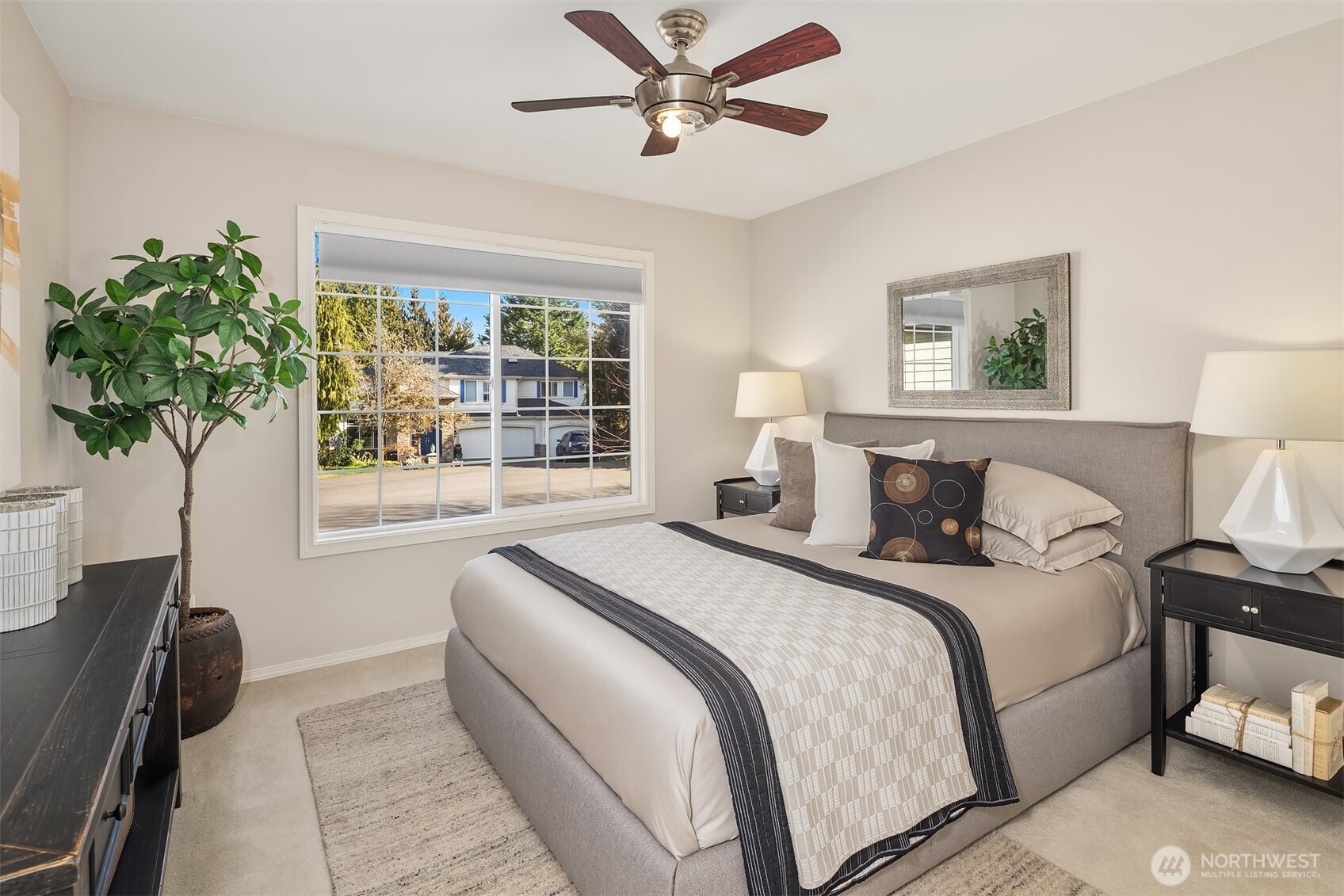 The professionally landscaped yard offers tons of privacy.