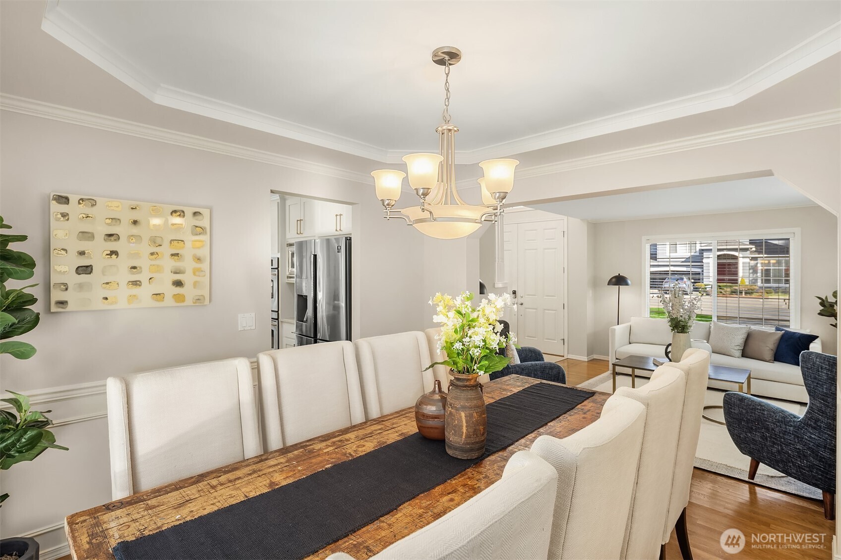 The family room and kitchen areas lead right directly out to the backyard with a stone patio and stunning landscaping.