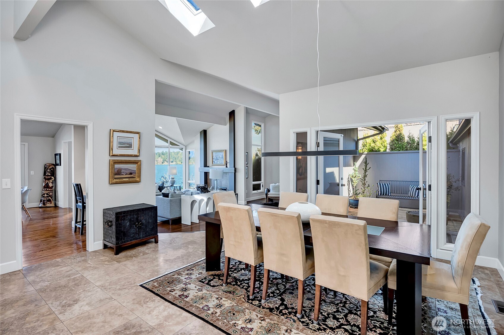 Just beyond, a peaceful courtyard with a fountain provides a private outdoor retreat, ideal for al fresco dining, container gardening, or simply enjoying a cool, shaded escape on warm summer days.