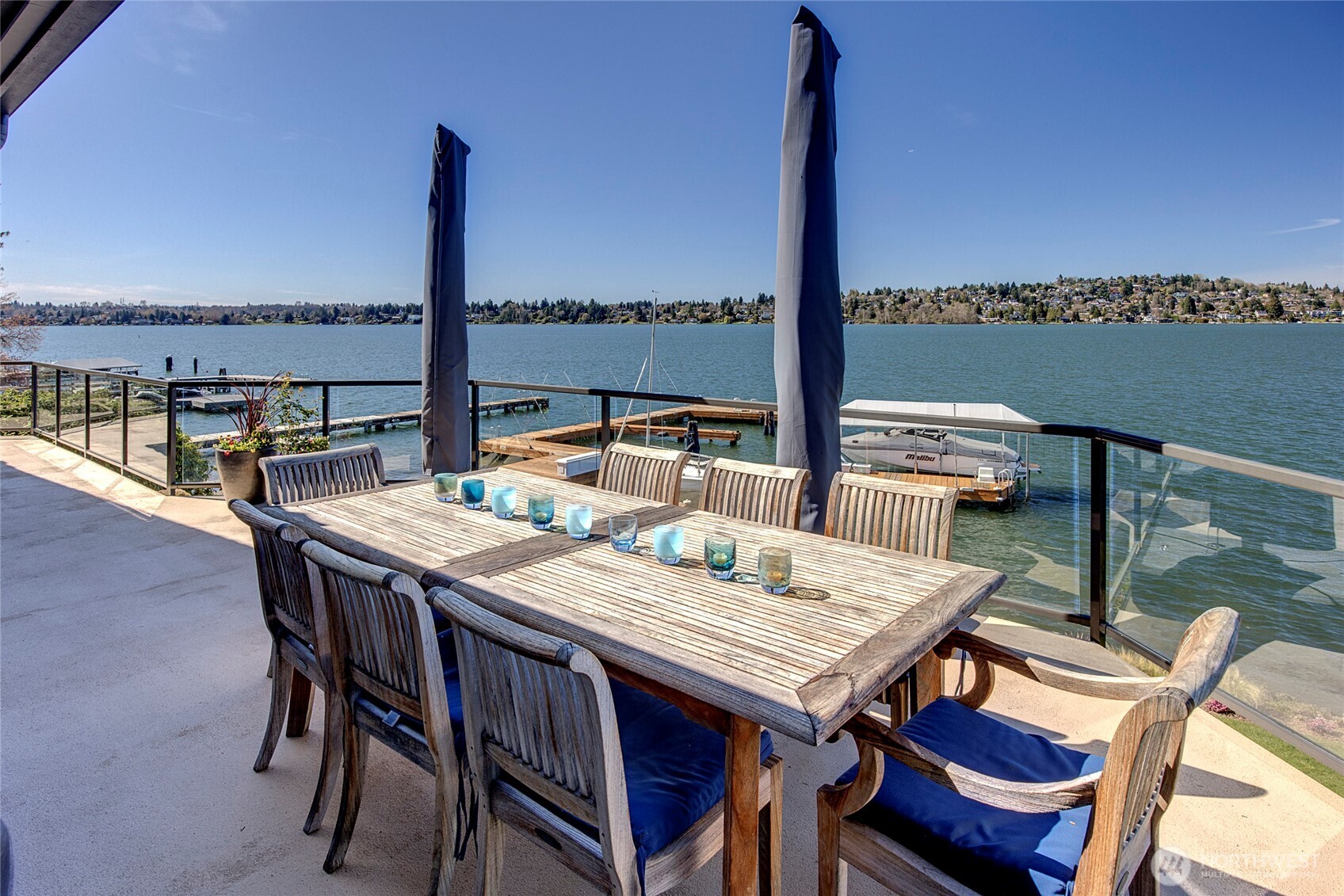 Expansive, unobstructed views stretch across more than 180 degrees from the deck, creating a truly immersive waterfront experience. Pictures can not capture how vast this view is.  This vantage is the perspective looking south.
